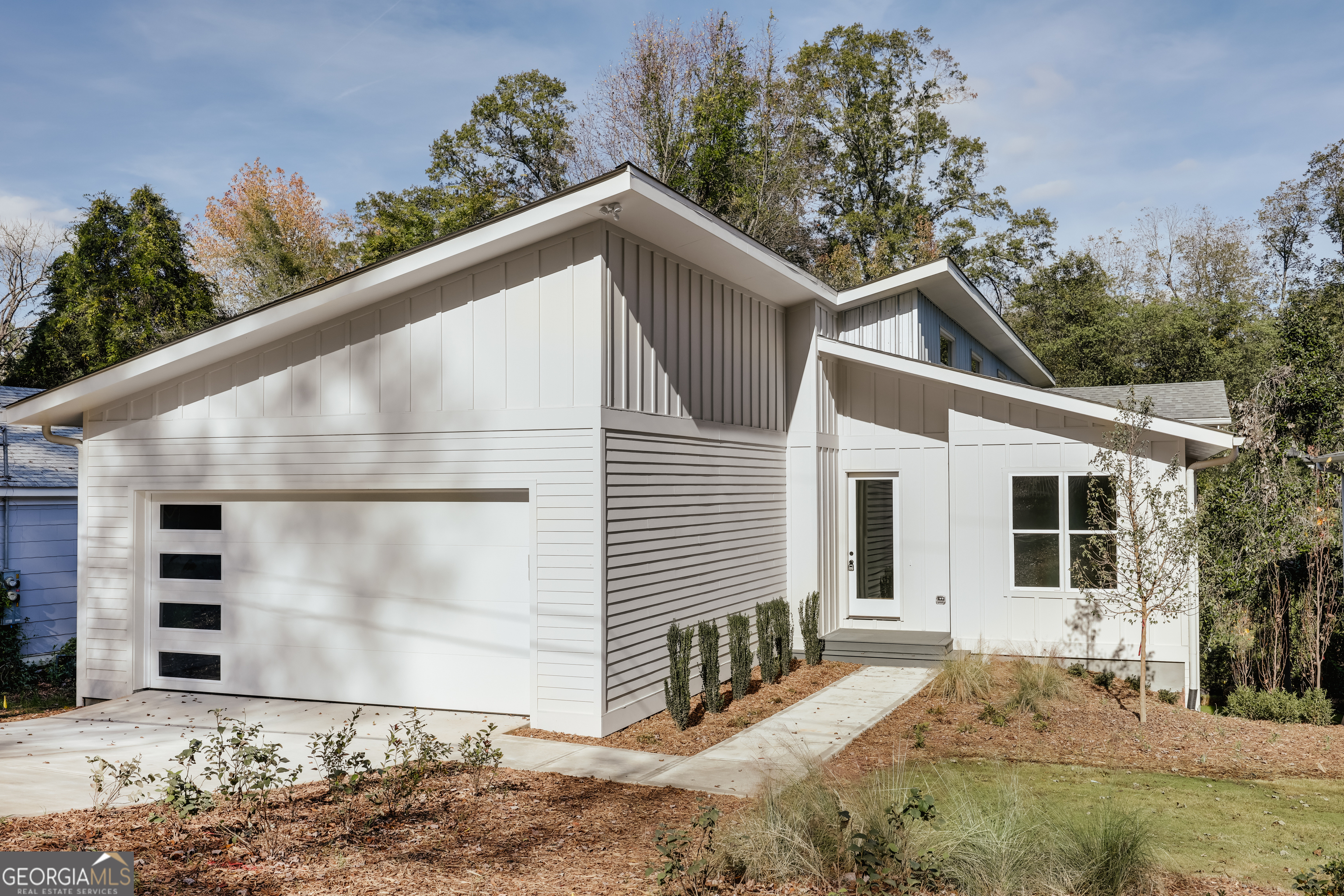 Special Interest Rate of 5.625%* with preferred lender and acceptable offer! Step into this thoughtfully designed Normaltown residence, where soaring ceilings, clean architectural lines, and sun-filled interiors create a light and airy feel throughout. The home features stunning white oak hardwood floors that flow seamlessly through the main living areas and bedrooms, enhancing the natural warmth and cohesion of the space. Just off the main hallway, you'll find a versatile office or flex space-ideal as a fourth bedroom-alongside two well-appointed secondary bedrooms. Each bedroom includes a ceiling fan, walk-in closet, and private en-suite bath complete with custom vanities and stylish tile surrounds. At the heart of the home lies an expansive open-concept living area that blends the kitchen, dining, and living spaces-perfect for both entertaining and everyday living. The chef's kitchen is outfitted with custom cabinetry, gleaming quartz countertops, a classic tile backsplash, walk-in pantry, and sleek stainless steel appliances. A generous center island offers ample bar seating and extra cabinetry ideal for a coffee or cocktail bar. Step through the dining area onto the screened porch and back deck, where views of Brooklin Creek and the private backyard provide a quite outdoor space. Tucked just off the living room is a charming alcove-ideal for a reading nook, study, or play area. The spacious primary suite is complete with an en-suite bath featuring floating dual vanities, a tiled walk-in shower with multiple shower heads, and a roomy walk-in closet. The home also includes a substantial unfinished basement with both interior and exterior access-offering excellent potential for a future in-law suite, media room, home gym, or generous storage. Located within walking distance to UGA's Health Sciences Campus and the vibrant restaurants and nightlife of Normaltown, this home blends modern comfort with urban convenience. Schedule your tour today and experience it firsthand. Seller is a licensed real estate agent in the state of Georgia. * Seller paid buy down of $15,000 to receive 5.625 (APR 5.726) as of 6/30/20215. With use of preferred lender and down payment of 20%. Contingent upon credit score. Rates are subject to daily change. Athens Mortgage Resources, Inc NMLS 165933. "Georgia Residential Mortgage Licensee"