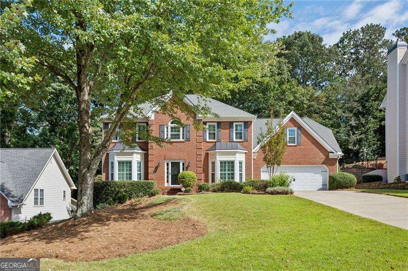 Location! Location! Location! Beautifully maintained 5-bedroom, 3.5-bathroom home in Parkland Place swim community, your Home Sweet Home. Conveniently located with easy access to interstates and just minutes from the Silver Comet Trail, Smyrna Market Village, The Battery/Truist Park, shopping, dining, parks, trails, and more! Set on a large, professionally landscaped lot, this home is brimming with character, space, and thoughtful updates. Step inside to find an easy-living floor plan that's freshly painted and move-in ready. Light pours in through abundant windows, showcasing gorgeous hardwood floors throughout the main level. The kitchen, featuring granite countertops, stainless steel appliances, and multiple dining areas, opens to a fabulous great room with a cozy fireplace, built-in bookcases, and stunning arched windows overlooking a serene, expansive backyard sanctuary. Enjoy peaceful mornings or lively evenings in the charming screened-in porch or on the spectacular double terraces. The sellers were first drawn to this home by its elegance and warmth, and quickly came to love its rare blend of luxury and practicality. From premium built-ins that add function and style, to a primary bedroom closet designed to make organization a snap. Upstairs, you'll find spacious bedrooms and baths, while the amazing lower level includes two large finished rooms, a full bath, and a storage area, ideal for guests, a home office, gym, or media/game room. The owners have taken great pride in maintaining and enhancing the home with updates, including new windows, doors, landscaping, irrigation, painting, and plumbing, ensuring both beauty and peace of mind. 1181 Parkland Run is more than a house; it's a home filled with heart, in a tranquil and friendly community that the current owners will miss dearly. Don't miss your chance to make it yours. Welcome Home!