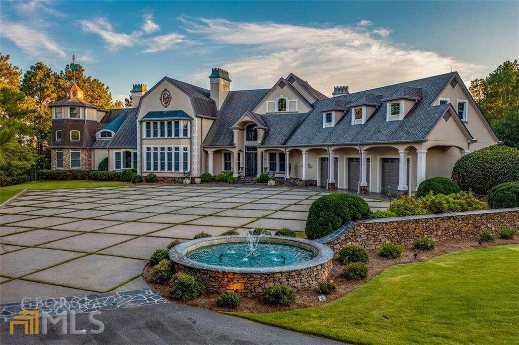 This Outdoor Paradise features 120 acres with all the wildlife north Georgia is famous for including Wild Hogs, Black Bear, Turkey and multiple herds of deer. This old style Architectural shingled home boasts 6 bedrooms and 11 bathrooms and an amazing grand foyer with its 29 foot ceiling. Exhibiting a custom crystal chandelier, the grand staircase will be the most remembered feature of this impressive home. The master bedroom features a floor to ceiling stone fireplace with a larger than life Trey Ceiling featuring a custom painted faoade. The adjacent master sitting area boasts an impressive floor to ceiling wall of windows, reaching upwards of over 25 feet. This unequaled property offers long range mountain views and 4 stocked ponds with seasonal trout, largemouth bass and bluegill. The first class kitchen features a large island, Wolf Stove with six gas burners and a Sub-Zero Refrigerator. The large entertaining patio area features a 12 ft. deep oversized pool and the southern portion of the pool house features a large outdoor kitchen featuring over 900 sq. ft. of outdoor grilling and entertaining area. The home has an Advanced Carrier HVAC system that includes a state-of-the-art electronic filter system with high efficiency units that are zoned for every room. The utility bills are substantially lower than comparable sized homes due to the interior walls and ceilings sprayed with Closed Cell Spray Foam for maximum energy efficiency. The large metal building features a well-maintained apartment and additional storage areas for boats, campers, or tractors.