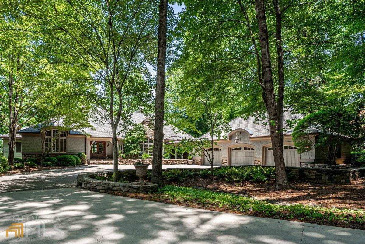 This One of Kind Lake Home was designed by renowned Architect Don Beck, constructed by William Taylor Customs Homes and it's simply one of the finest homes ever built at Reynolds Lake Oconee. Both inside and out of this 6300 Square Foot home you will find wonderful architectural details where every element was carefully selected and quality crafted. This Home lacks for nothing. The 4 Bedroom / 4.5 Bath Home is spread out over 2 levels and it has wonderful living spaces both inside and out that take advantage of the big main lake views to Lake Oconee from almost every room in the house. Designed for grand entertaining and family living, this Home is impressive yet comfortable. For a discerning Buyer, this Home must be seen to be appreciated. Seller is making a Club Membership available.
