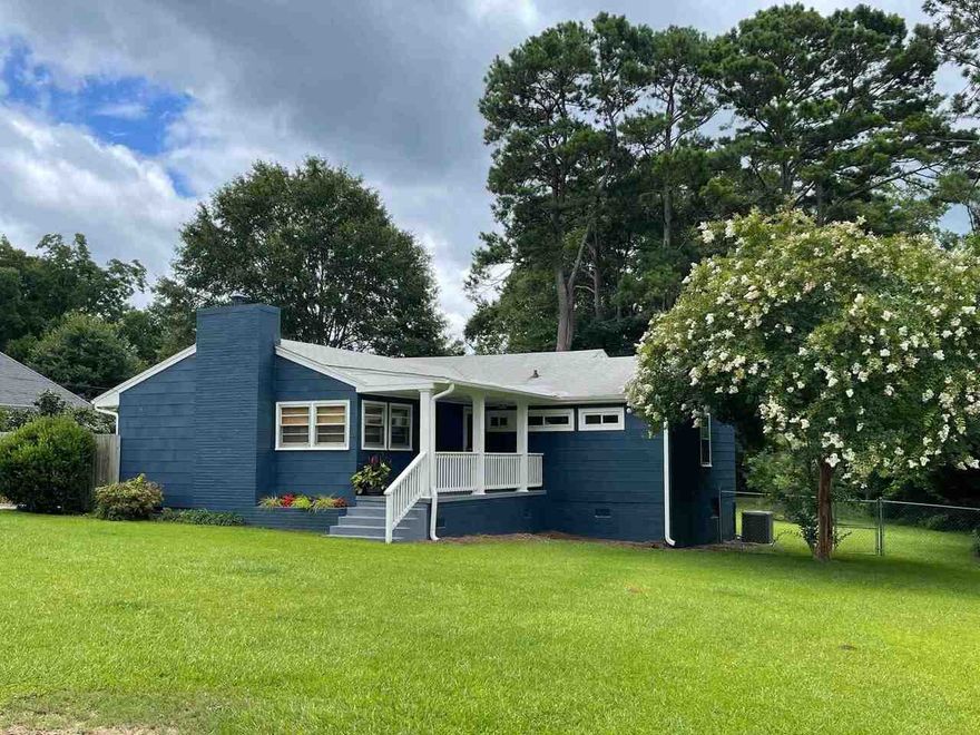 ADORABLE IN TOWN HOME ON .76 ACRES W/ FANTASTIC OUTDOOR LIVING AREA & GREAT PERSONALITY!  Lots of windows and natural light throughout the home.  Home has hardwood and tile floors throughout.  The bedrooms are large.  Kitchen is roomy!  All kitchen appliances remain.  Sunroom on back.  Garage was enclosed and could be a 3rd bedroom (not included in the square footage reported).  Currently has hvac window unit and used for storage.  Beautiful and relaxing outdoor living area w/ small above ground pool or use area for a fire pit in the off season.  Easy to transition between the two.  Updates throughout home and newer hvac and hot water heater.  Updated plumbing.  New termite bond that can transfer to the buyer.