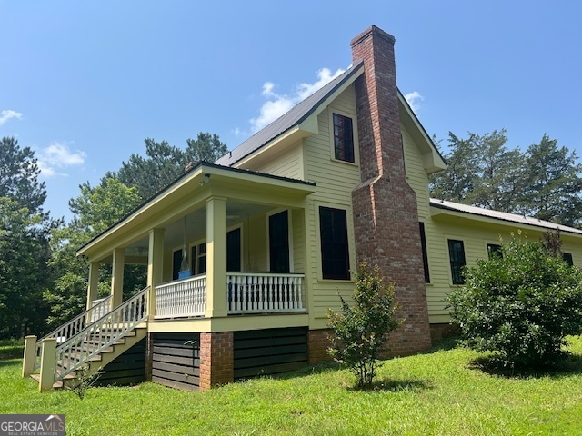 COMING SOON! - Welcome to your peaceful retreat just minutes from town! Built in 2020 and thoughtfully designed for comfort and style, this beautiful home is nestled on over 6 acres of scenic land, complete with a tranquil spring-fed pond. On the main level of the home, there is a primary suite with a private en suite bathroom. Both the living and dining rooms are each warmed by its own cozy fireplace, creating the perfect setting for relaxing nights or entertaining year-round. Upstairs, two additional bedrooms share a full bath-perfect for guests or family. Whether you're sipping coffee on the covered front porch or enjoying the natural beauty that surrounds you, this property offers a rare blend of modern convenience and rustic charm. Don't miss your chance to see it-showings start June 14th!