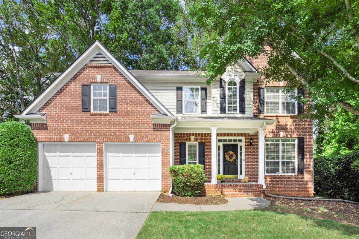 This is the one!! Highly sought after Hidden Springs home in the award-winning King Springs Elementary school district! This charming cul-de-sac home boasts hardwood floors throughout the main floor, an open-concept kitchen into a beautiful sun filled two-story living room, and a full daylight unfinished basement perfect for extra storage, a work area, or your next project. The updated kitchen includes white raised panel cabinets, stainless steel appliances, granite countertops, and new light fixtures. Upstairs, retreat to the generous primary suite with a raised ceiling, built in bookshelf, and two walk-in closets. Three additional bedrooms share an updated hall bath, providing flexible space for family, guests, or a home office. While being just under 10 minutes to I-285, a short distance to Truist Park / The Battery, Smyrna Market Village, Silver Comet Trail, and top schools, this home delivers the perfect balance of comfort, charm, and convenience.