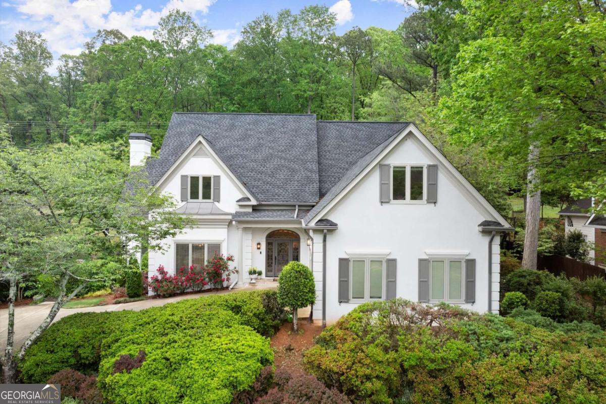 Live in luxury in the highly sought-after Waterford Green community, located in East Cobb's premier school district. Backing up to the Chattahoochee National Park with Gold Branch Trail access just steps away, this beautifully updated home offers rare privacy, abundant space, and refined finishes throughout. Recently renovated with over 1,000 square feet of additional finished space, the home features a light-filled great room with soaring ceilings and a stunning folding glass wall that opens to a bright sunroom. The chef's kitchen includes quartz countertops, a Samsung gas cooktop, floor-to-ceiling cabinetry, and a breakfast nook with views of the serene backyard. The main-level Primary Suite offers a spa-like bathroom with a soaking tub, heated tile floors, double vanities, and a large walk-in closet. Upstairs are four generously sized bedrooms and two updated full baths, including a Jack-and-Jill layout. The finished terrace level is perfect for entertaining, with a media room, modern bar, flexible living areas, and a walk-out covered patio. Additional highlights include hardwood floors, designer lighting, a new roof, fresh paint, and a Brazilian Koa wood deck overlooking a professionally landscaped yard. Waterford Green residents enjoy top-tier amenities right across the street, including a pool, tennis courts, clubhouse, playground, and more. Convenient to Roswell, Sandy Springs, and all East Cobb has to offer-this exceptional home is now available for lease. Credit check and background check are outsourced to a third party. Credit Check & Criminal Records screenings are mandatory. Tenant(s) combined income must be 3 times monthly rent. All tenants 18+ must fill out application. Application fees are non-refundable: $55.00 for an individual & $65.00 for a married couple. Schedule your private tour today!