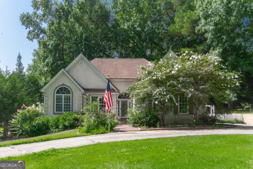 Discover the elegance and comfort in this Victorian-style home. The grand foyer opens to a spacious living room with a custom fireplace, leading to an open dining room perfect for gatherings. A bright sunroom offers a peaceful retreat. Kitchen features a breakfast area and butlers pantry. The primary bedroom boast a custom tray ceiling, walk-in closet, and an ensuite featuring a soaking tub and dual vanities. Two additional bedrooms and a well-appointed bathroom grace the main level, ensuring comfort for family and guests alike. Versatile bonus room upstairs, perfect for a private study, media center, or creative space. The lower level reveals a self-contained haven, featuring utility rooms, an additional bedroom, bathroom, kitchenette, and sitting area-ideal for multi-generational living or entertaining on a grand scale.Situated near the Connector Trail, this home offers easy access to nature's splendor. Schedule your tour today!