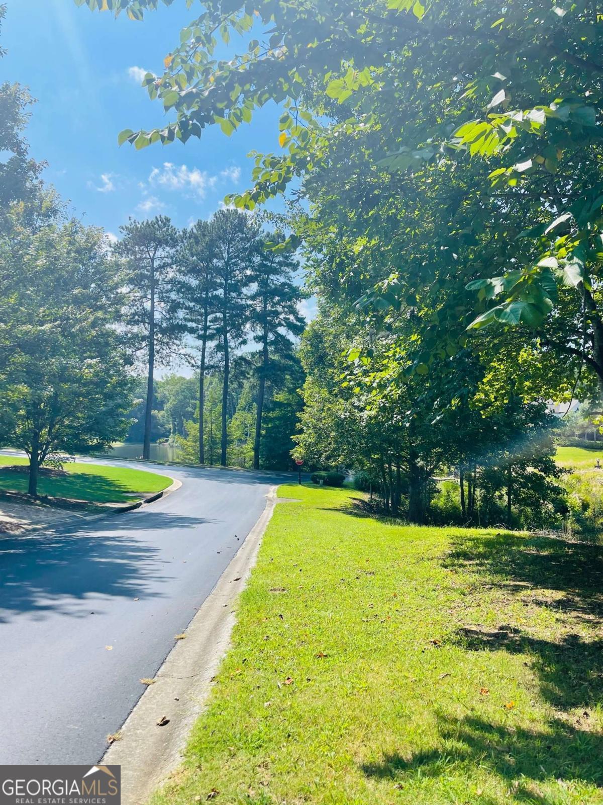 What a beautiful approach to your new lot. Enjoy a quiet, peaceful drive, as you cross the bridge, taking in stunning lake and golf course views. A quick left turn and you're home. With 1+ acre lots, each home site is private and offers ample space to create your own peaceful retreat while still enjoying a sense of community. Come experience the magic of Hawks Ridge. You'll be glad you did.