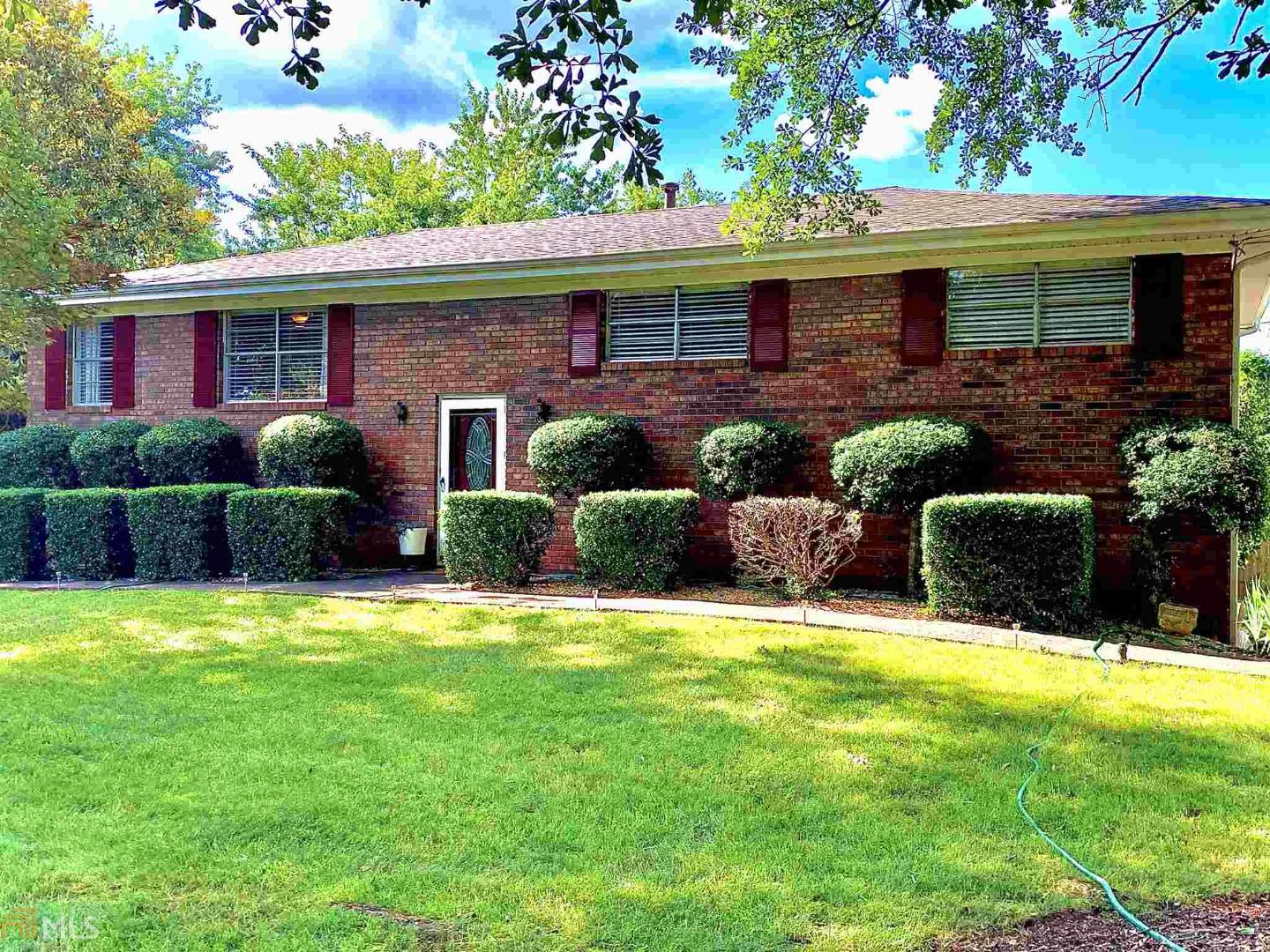 A Slice of paradise in Marietta, Gorgeous 20,000 gallon pool with ample lounging space and two large decks, Sprawling southern yard with large old growth Magnolia and Oak trees, New Roof, Upgraded tile, stone, and hard woods throughout, Sellers will provide a free one year home warranty, this polished gem won't last long, set up a showing today!