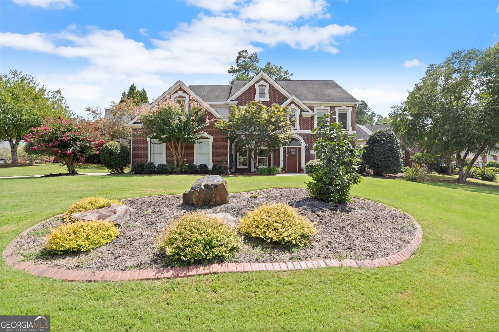 This tastefully renovated home is filled with natural light and elegantly curated finishes. The hub of the home is the gorgeous eat-in kitchen which features a Wolf cooktop with a beautiful custom-made range hood, double ovens, Cambria Quartz countertops, a six foot island, a super quiet Bosch dishwasher, and a breakfast bar. Sunshine streams through the arched windows in the two-story, southern-facing great room. Electric fireplace can be for show or to gently warm when it's chilly. The open floorplan creates easy flow for gathering and entertaining which extends from the formal dining room to the exterior patio. The backyard is secluded and fenced with lush landscaping. A separate living room off the foyer has been fashioned as a gentlemen's drawing room in rich earth hues. Guests enjoy a private bedroom and full bath on the main level. Upstairs, the primary bedroom suite features an adjacent nursery or dressing room and a Hollywood Glam bathroom with a luxurious, standalone tub, a spacious (doorless) walk-in shower, and a private water closet. The Home Office with glass doors opens to the catwalk. Two additional bedrooms enjoy sunset views and share a sleekly updated bathroom. Bonus! Rear stairs were removed to create several additional storage closets. And, there is an attached storage shed behind the two-car garage. The HOA manages the club house, swimming pool and tennis courts situated at the entrance to the neighborhood. Located near all that makes Alpharetta awesome. Walk or ride to Webb Bridge Park and the Greenway. Enjoy Avalon Nights Live at Alpharetta's premier shopping and dining district. Top performing schools include Lake Windward Elementary, Webb Bridge Middle School and acclaimed Alpharetta High School, which offers International Baccalaureate (IB) as well AP courses along with an impressive array of athletic programs and extracurricular activities. A very special HOME in an exceptional community.