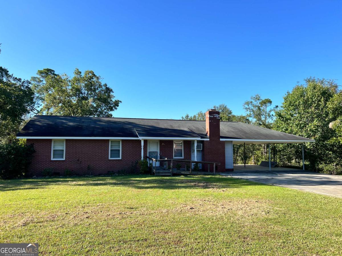 Welcome to this 3 bedroom, one-and-a-half bath brick home situated on a corner lot. The fenced-in backyard offers privacy and includes two storage units, perfect for your outdoor needs. A double carport provides ample parking, while inside you'll find a large living room, a separate dining room, and a generously sized laundry room for added convenience. Whether you're looking for a starter home or seeking to expand your investment portfolio, this property is an excellent opportunity you won't want to miss.