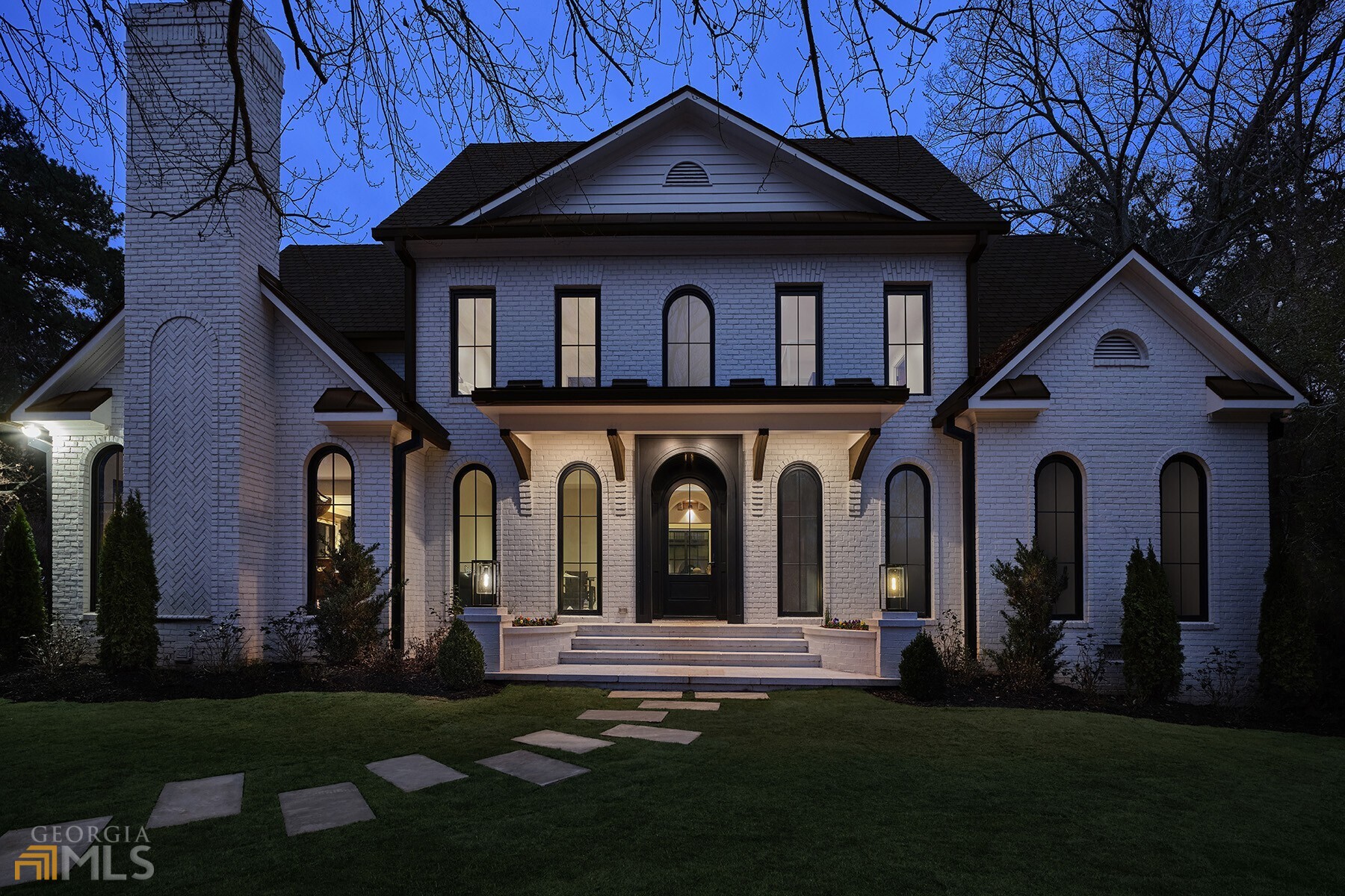 Bespoke Luxury newly reconstructed traditional home (completed 2023) idyllic setting. Eric Rothman designed this Intown Renaissance masterpiece yielding the show-house of the Decatur's spring season. Nestled behind a gated fully fenced estate lot located on the eastern edge of Olmstead's famous Druid Hills Neighborhood. Just steps away from Decatur's vibrant destination entertainment district, this home offers the distinction of Druid Hills with the charm of Decatur Square plus City Schools of Decatur. Newly installed, wide-plank quarter-sawn hardwood floors on all three levels. Metal clad windows custom by JELD-WEN throughout. A grand Hartstone saltwater heated pool with outdoor jacuzzi adjacent to gas-fire feature affording a dramatic focal point from the double story great room. Inside, discover a polished cement, sunken family space showcasing a metal clad modern-chic chimney flanked with custom built-ins housing the massive masonry wood-burning fireplace. The largest full-wall bar includes an ice maker and two massive, refrigerated wine storage columns. Accenting the bar is a 2nd story Juliette balcony. An open-air cat-walk canopies the step-up connecting corridor featuring natural toned pine, tongue and groove ceilings presenting a work of art, hand-crafted 3 story curved stairwell with footstep lighting and industrial-styled metal wainscotting. The informal dining room offers floor to ceiling windows and a 2nd masonry fireplace with decorative gas-lit chimney balls and wide-open to the end-all kitchen. Entertainers will delight in the waterfall marble, free-floating double island. As twin breakfast bars afford massive counter-space, each includes a prep sink and dishwasher. Chef's dream with 2 sub-zero custom cabinet refrigerators and one full size subzero custom cabinet freezer, columns of hidden shelving offer layers of storage. A commercial-grade gas range by Wolfe is flanked by tremendous marble counters extending even into a windowed butler's pantry with hidden overflow refrigerator All 5 bedrooms are en-suite with main floor owner's luxury chambers. The space also offers a movie star's spa-styled bath. Dripping with modern style, the oversized Spa shower has lovely stone-work floors and elegant glass surround. Marble and granite dovetail with elegant warm wood for the floating, double vanity featuring loads of drawer storage and mirrored walls. Chic, free-standing soaking tub is a centerpiece for ultra-cool bath. The owner's walk-in dressing room features a central marble-top island in front of a most terrific, lighted glass shoe-storage wall. Wardrobe space is abundant and the adjacent storage chamber is complete with private washer-dryer. This celebrity suite even features a wood burning masonry fireplace w/ gas starter. Upstairs there is owner's suite #2. With tongue and groove vaulted ceiling + double doors looking over the balcony into the great room, this space could make a handsome men's den with an impressive 2nd luxury bath. Three additional upstairs suites have fantastic, beautiful marble baths with modern accoutrements absolutely on trend for guests. The third floor is a yoga studio and is a delightful play area for active folks of every age. A front office library is the work from home private studio. Opening the double mahogany front doors your guests will know they've arrived as something special. A two car carriage house has a lovely guest cottage above with a kitchenette bath and great room. Pervious pavers create ample parking and flat driveway. Garden stones accent the landscape on 4 sides. This is a lucky find for discerning buyers wishing the finest luxury within the heart of the South's finest small town; a most pedestrian friendly community with a vibrant progressive population + 1 of Atlanta's most awarded k-12 public schools.
