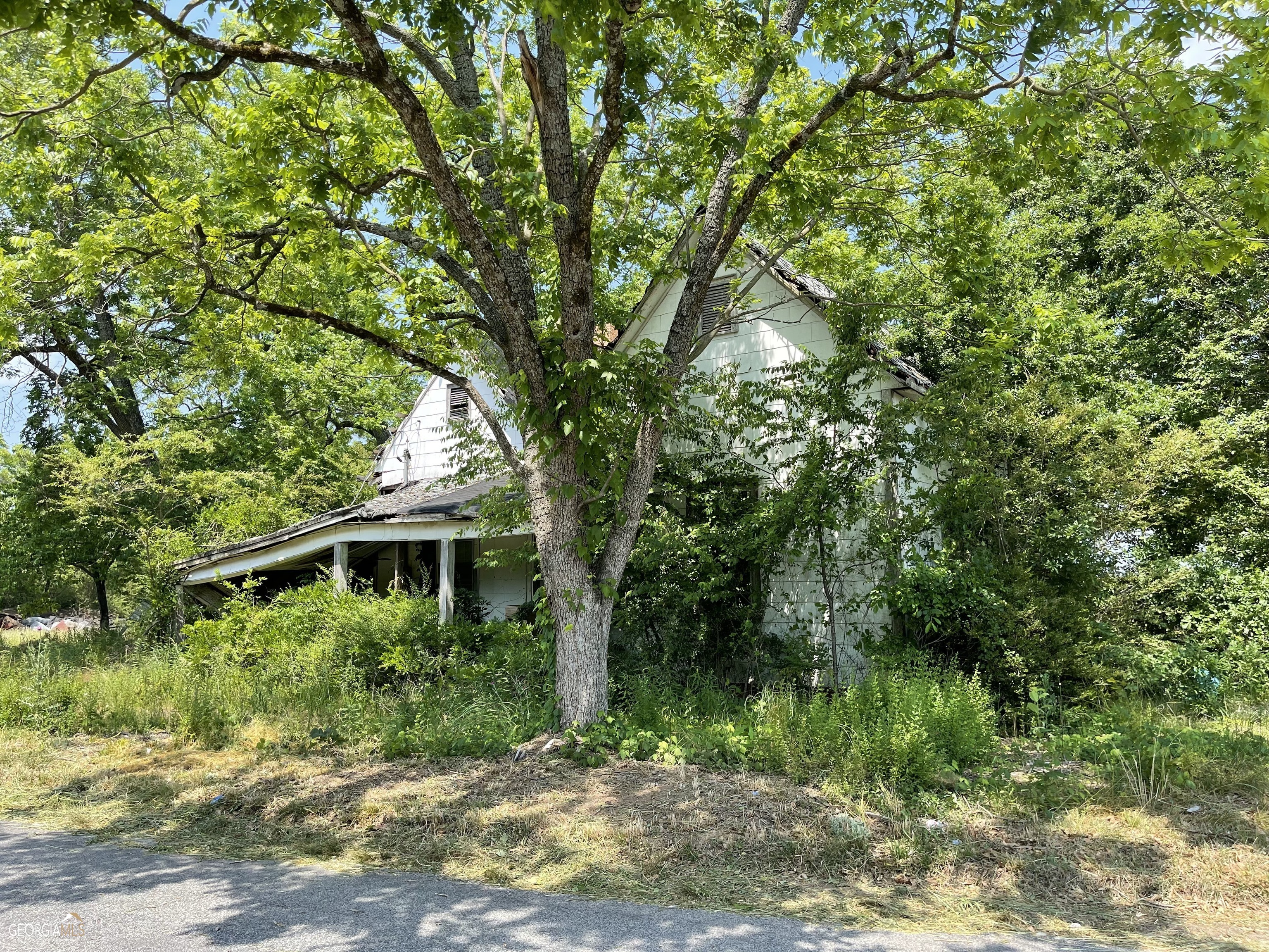 Homesite on 1.3 acres in the country with no restrictions. Property is being sold "AS IS" with no representation regarding the condition of the home and whether there is a well and septic tank on the property.