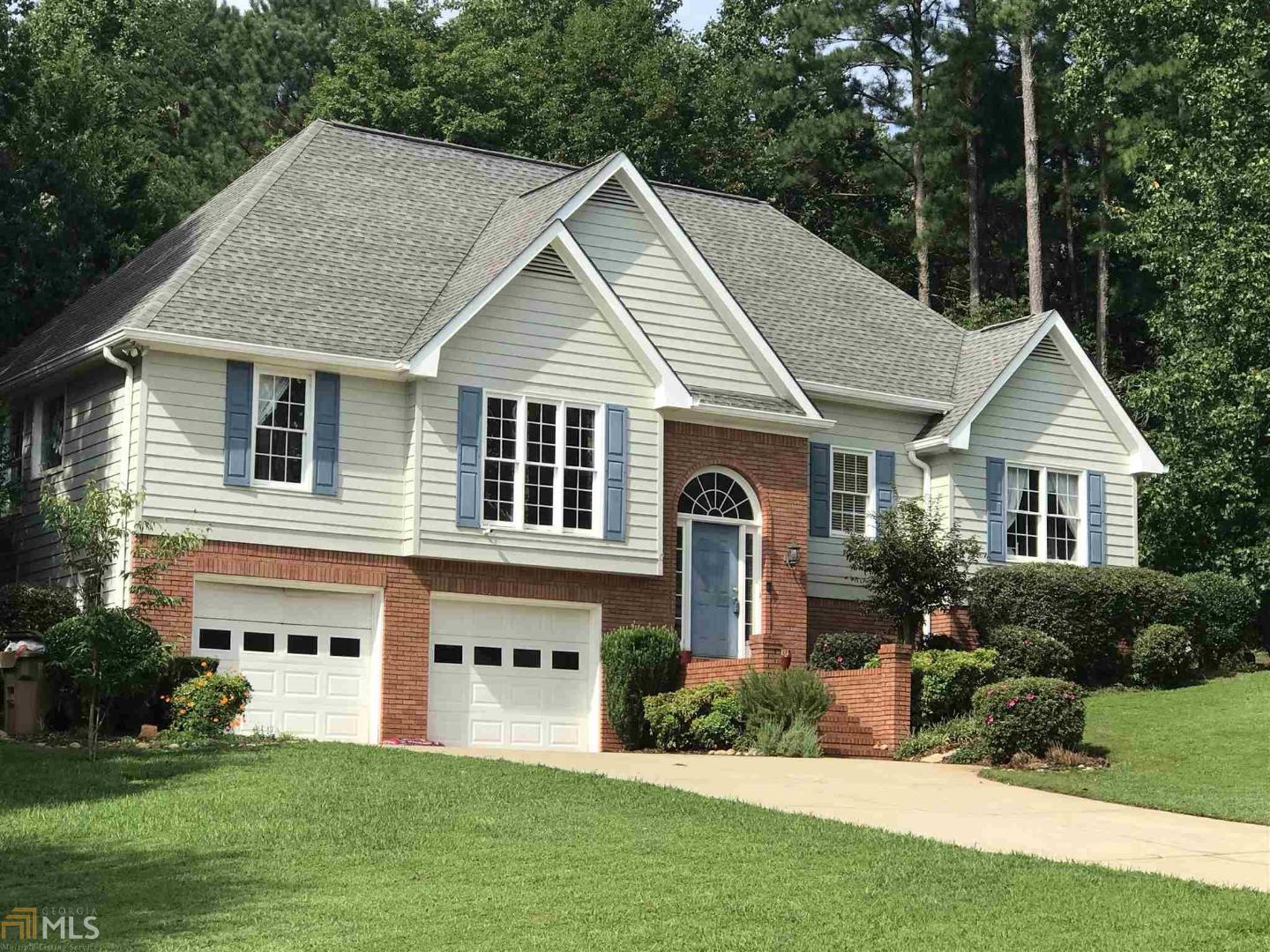 Relax in your own gunite, heated salt water pool with pebble tec finish all year long! Very private setting surrounded by woods and foliage. Just thru the gate to the side yard is another beautiful area of the property complete with an area for dirt biking! The owners are leaving the wooden play equipment as well. This large home consist of 3 BR & 2 full baths on main lvl and 1 BR & bath on lower level as well as a family room which could be a 5th BR. Located in a cul de sac and very convenient to I985, McEver Rd. and 3 miles to Balus Creek boat launch and park. This is a split bedroom plan and the master suite is just off the kitchen which leads to a screened in porch that looks out over the inground pool. The great room has a vaulted ceiling, fireplace, built in bookcases as well as a long shelf above the sofa to display your most favorite decorative pieces. There is an oversized 2 car garage attached and a very long level concrete drive for additional parking (maybe your RV or boat!).