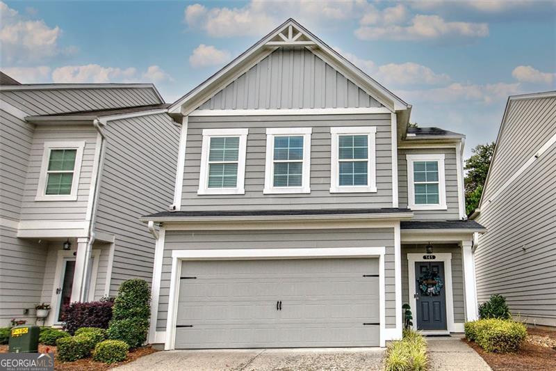 Welcome to 141 Millers Ln in Calhoun! Built in 2021 and immaculately cared for, this stunning home offers over 1,800 sq. ft. of modern living space with 3 bedrooms and 2.5 bathrooms. Nestled inside the sought-after Old Mill gated community, residents enjoy exclusive amenities including a clubhouse, swimming, and tennis. Step inside to an open-concept floor plan featuring luxury vinyl plank flooring throughout the main level. The heart of the home is the chef-inspired kitchen with a spacious oversized island, granite countertops, and stainless steel appliances, seamlessly flowing into the living room-perfect for entertaining. Upstairs, retreat to your spacious owner's suite complete with a walk-in closet and an enlarged spa-like bath featuring double vanities. Two additional bedrooms also enjoy access to the breathtaking mountain views, making this home truly special. Relax on the front porch with your morning coffee while soaking in the beauty of the surrounding landscape. As an added bonus, this home qualifies for 100% USDA zero down financing! Plus, ask about first-time homebuyer programs that may provide up to $12,500 in down payment assistance or contributions toward closing costs. Don't miss your chance to call this move-in ready home yours-schedule your showing today!