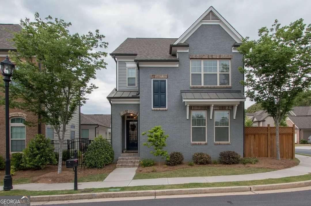 Available to show immediately and rent on August 20th. Rare opportunity to rent in Three Bridges. This is a beautiful 4-bedroom single family home in the gated community of Three Bridges in Suwanee. Fun neighborhood with lots of events and tennis/pickleball court and pool. In the highly sought after North Gwinnett cluster. Open concept living, dining room and kitchen. Granite countertops with custom cabinetry and SS appliances in kitchen. Oversized master with attached sitting room/office. Custom Hardwoods on main level and hallway upstairs. Walking distance to SimmCOs Lake Park. Updated bathrooms with a master closet you could get lost in. Rent includes trash and lawn care. All appliances stay. Laundry room on second floor. 1 dog allowed with pet deposit. No smoking.