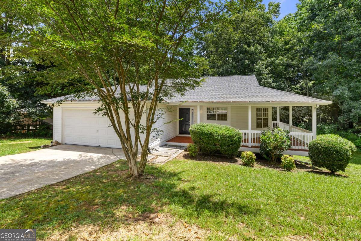 Welcome to 8515 Opal Ct, a captivating ranch-style home nestled in a peaceful cul-de-sac in Gainesville, GA 30506. This charming property seamlessly blends classic design with modern updates, offering a perfect balance of comfort and style. From its inviting wrap-around porch to its newly renovated interiors, this home is ready to capture your heart and become your personal oasis. A couple of its additional features include: - New granite countertops and stainless steel appliances will inspire your inner chef - New carpets throughout all of the bedrooms that add a touch of luxury underfoot - The master bathroom features a lovely soaking tub, perfect for unwinding after a long day - A dedicated laundry room adds convenience to your daily routine. - A back deck, an ideal space for grilling, dining al fresco, or simply enjoying the outdoors Situated in the heart of Gainesville, this home offers the perfect blend of suburban serenity and urban convenience. You'll have easy access to local amenities, schools, and recreational areas while still enjoying the peace and privacy of your own slice of paradise. Don't let this opportunity slip away - make 8515 Opal Ct your new home and start living the life you've always dreamed of in this charming ranch-style haven!