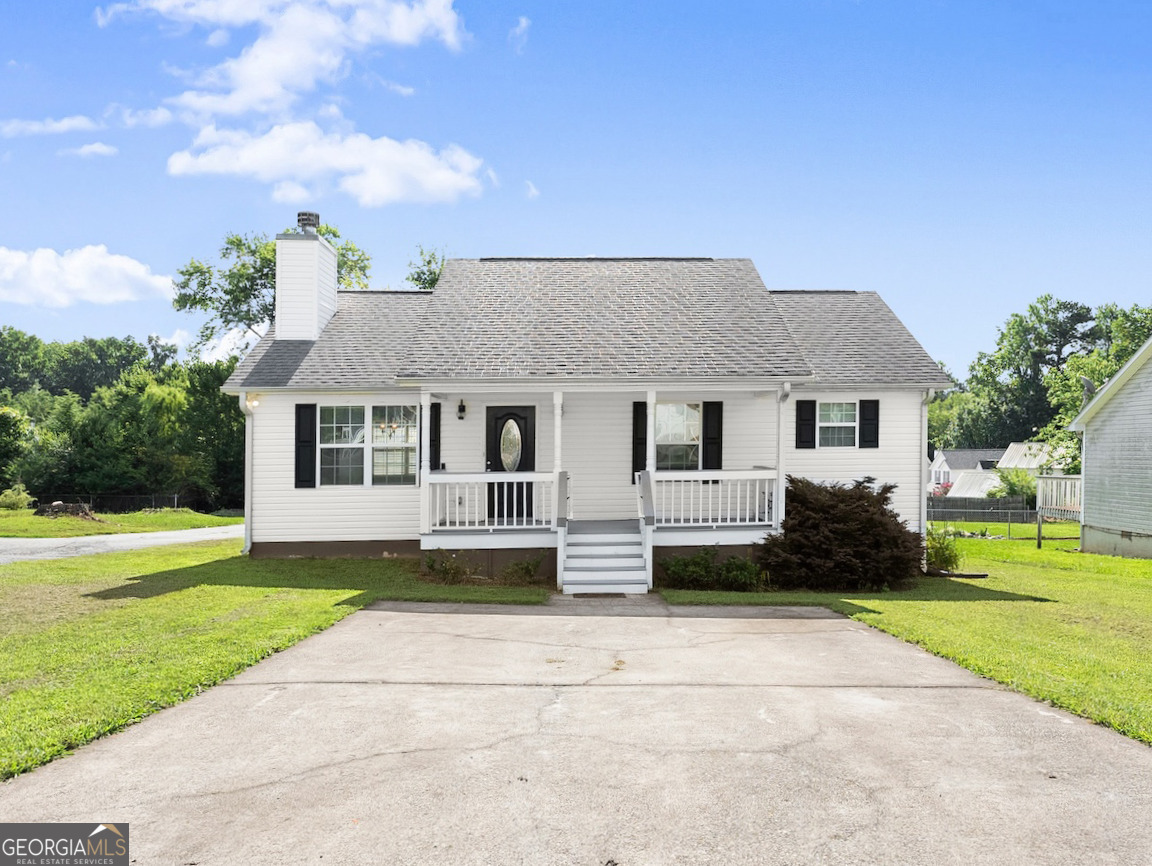NO HOA! This charming 2-bedroom, 2-bath single-family home offers 1,000 sq ft of well-maintained living space and is ideally located within the city limits of Dawsonville. Built in 2005 and situated on a generous 0.26-acre lot, this property features a fenced backyard, updated front porch with durable Trex decking, and both front and back porches-perfect for enjoying the outdoors. Inside, you'll find hardwood floors throughout, a functional layout, and all appliances included-refrigerator, washer/dryer, dishwasher, and more-making this home completely move-in ready. Whether you're a first-time buyer or investor, this home is a solid choice for rental income or long-term value. Located in a USDA-approved area, eligible buyers may qualify for 100% financing. With driveway parking, a quiet yet convenient location, and strong rental potential, this home is a rare find in one of North Georgia's fastest-growing areas. Don't miss this opportunity-schedule your showing today!