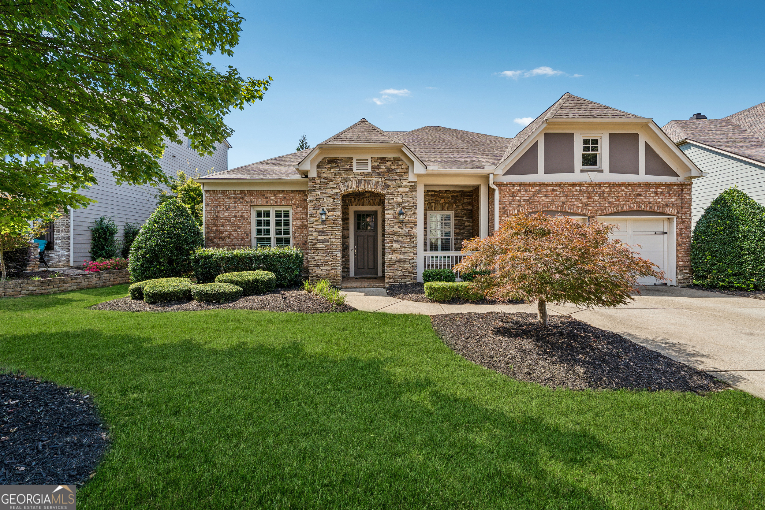 Rare 4 Bedroom / 4 Bath Ranch with Master on Main in Telfair! Step into your dream home in West Forsyth's highly sought-after Telfair community! This spacious ranch features 4 bedrooms, 4 full baths, and a versatile upstairs bonus suite. From the welcoming front porch to the expanded covered screened porch, every detail is designed for comfortable family living, entertaining, and relaxing in style. Inside, a bright foyer opens to separate formal dining and living rooms, ideal for gatherings. The chef's kitchen boasts crisp white cabinetry, an oversized island, and a breakfast area overlooking the great room with a stunning marble fireplace. The main level features the oversized owner's suite with a rainfall shower, his and hers closets, and a soaking tub. The main level also offers two generously sized bedrooms, two full bathrooms, and a versatile office nook-ideal for remote work or quiet study. A cozy sitting room serves as a central space that can be used as a playroom, lounge, or study area, providing both connection and privacy between the rooms. Upstairs, the bonus suite includes a remodeled full bath with and a walk-in closet, offering a perfect space for guests, teens, or a private getaway. Outdoor living is exceptional with an extended screened porch perfect for entertaining family and relaxing year-round. The professionally landscaped yard and wrought-iron fencing add charm and privacy. Recent updates include a brand-new furnace, brand new air purification system with UV, newer roof, HVAC, stainless steel appliances, and fresh interior paint. Enjoy resort-style Telfair amenities: clubhouse with pool and splash fountains, two lighted tennis courts, and a playground. Conveniently located near Vickery Village, Halcyon, shopping, dining, Big Creek Greenway, and zoned for the award-winning West Forsyth High School District. This home truly has it all-4 bedrooms, 4 baths, master on main, modern updates, bonus suite, extended porch, and top-rated schools in an unbeatable location!