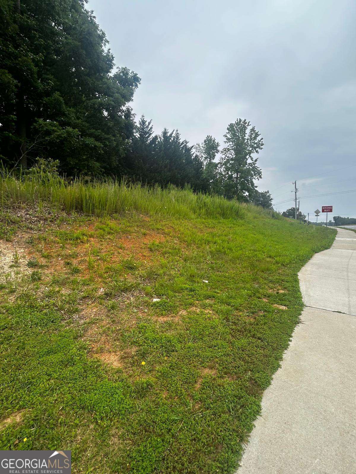 Unique investment opportunity on 6315 Spout Springs Road, Flowery Branch, GA 30542 - this prime lot is perfectly positioned in a high-growth corridor surrounded by ongoing commercial and residential developments. With excellent road frontage and high traffic visibility, it offers incredible potential for future retail, mixed-use, or long-term investment. Additionally, the property allows you to build your dream home or place a mobile home, offering even more flexibility for residential or income-producing use. Land in this location is becoming increasingly scarce, making this a rare chance to secure a valuable piece of rapidly appreciating real estate.