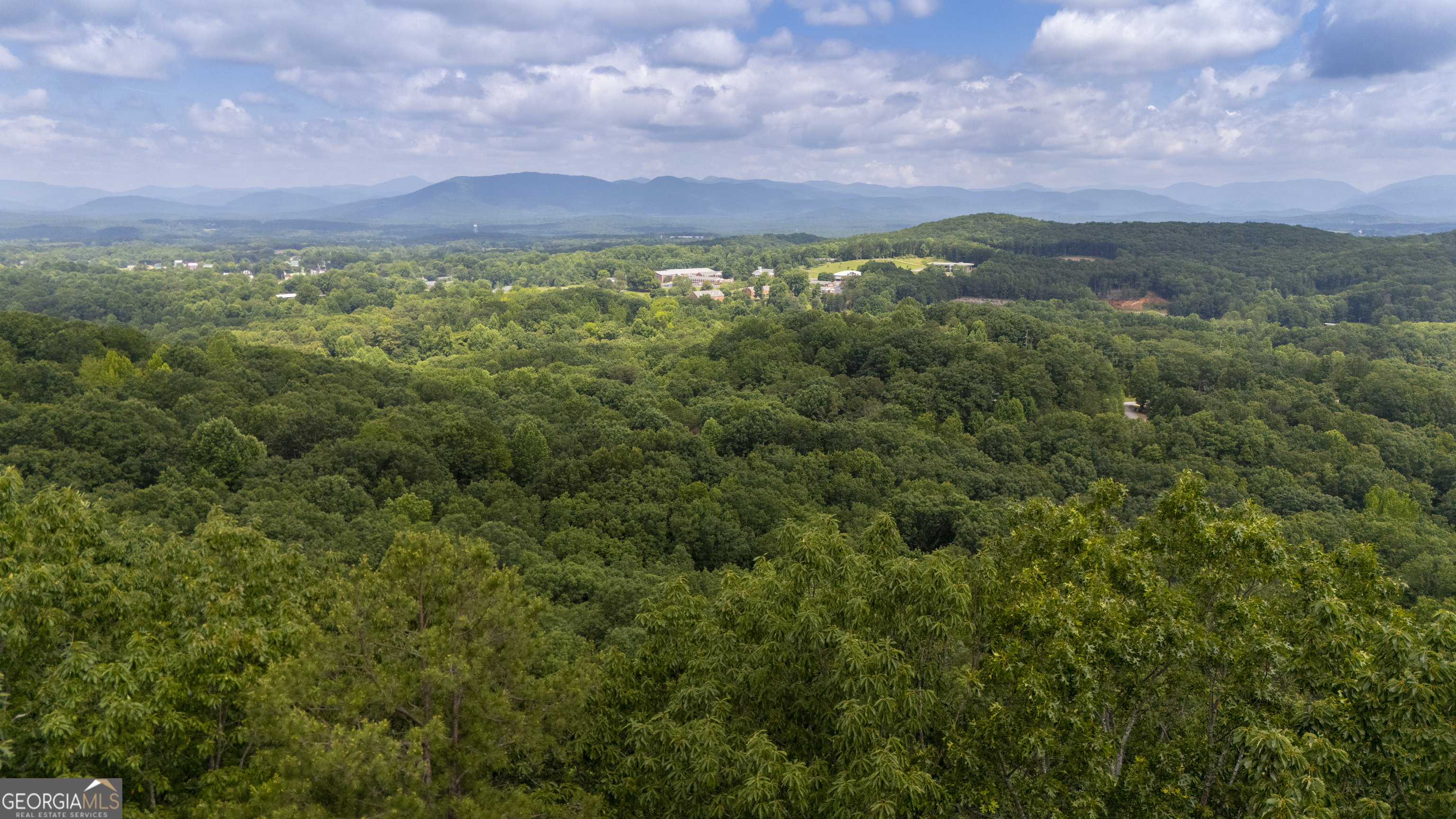 Incredible Mountain Views from this 1.2 acre lot in Cleveland. Septic already in for a 2 bedroom home and site plans available for your build. Don't miss your opportunity to own a lot to build on with spectacular views overlooking Truett McConnell University and the gorgeous mountains!!! Driveway already cut in down to the area where the septic system is. Site plans available if interested.