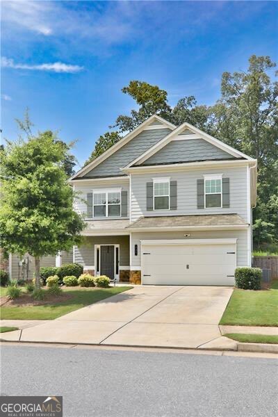 Inviting 4 Bedroom Home in Pristine Canton Community! Beautiful 4 bedroom, 2.5 bath home perfectly located just minutes from the excitement of Downtown Woodstock and the new shops and restaurants coming to Downtown Holly Springs. The open-concept main floor features well appointed seperate dining room, rich flooring, tons of natural light, and a bright, spacious kitchen with stainless steel appliances, 5-burner gas stove, oversized island, corner pantry, and sunny breakfast nook flowing right into the fireside family room with built-in cabinetry. Upstairs, the oversized primary suite offers a relaxing sitting area, spa-style bath with double vanity, tiled shower, soaking tub, and a large walk-in closet. Three additional bedrooms and a generous loft space provide plenty of room for work, play, or guests. Out back, enjoy a private yard ready for your personal backyard vision - whether it's entertaining, gardening, or simply relaxing under the stars. Just outside the neighborhood, you have great sidewalks for long walks. You can easily walk to eateries and grocery stores! Convenient to 575, schools, shopping, and medical facilities.