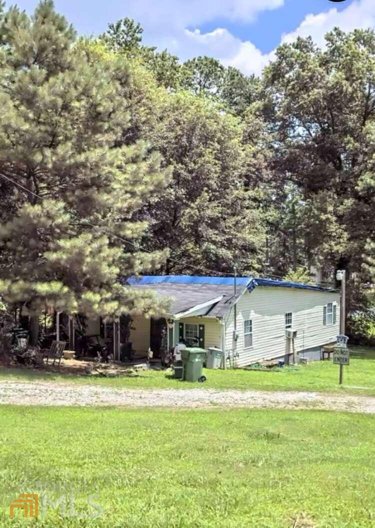 Motivated Seller ** PRIME LOCATION** This 4/2 home is being sold along with the adjacent parcel Priced To Sale. Sold 'AS IS', Clear Title. You don't want to miss this investment opportunity in Desired Grove Park Area. The house needs extensive work but well worth the price for 2 lots combined lot size of .33 acres Intown Atlanta. Minutes from EVERYTHING incl Microsoft Future HQ, Quarry Yards, Multi-Million Dollar Mixed-use Development, New Construction Homes all around including same street & street over selling @ $400's & up+,8-10 mins to Mercedes Benz Stadium, Phillips Arena, Braves Stadium, Atlantic Station, Georgia Tech, Atlanta Beltline, Top Golf, Restaurants & Much More! Get in now while you can, this won't last long! Sold as-is, No Disclosures. Seller never occupied property. Minimum $4K EM. Short DD & Quick closing preferred.