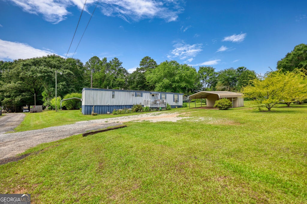 Photo of 697 Rocky Plains Road, Covington, GA 30016 (MLS # 10809429)