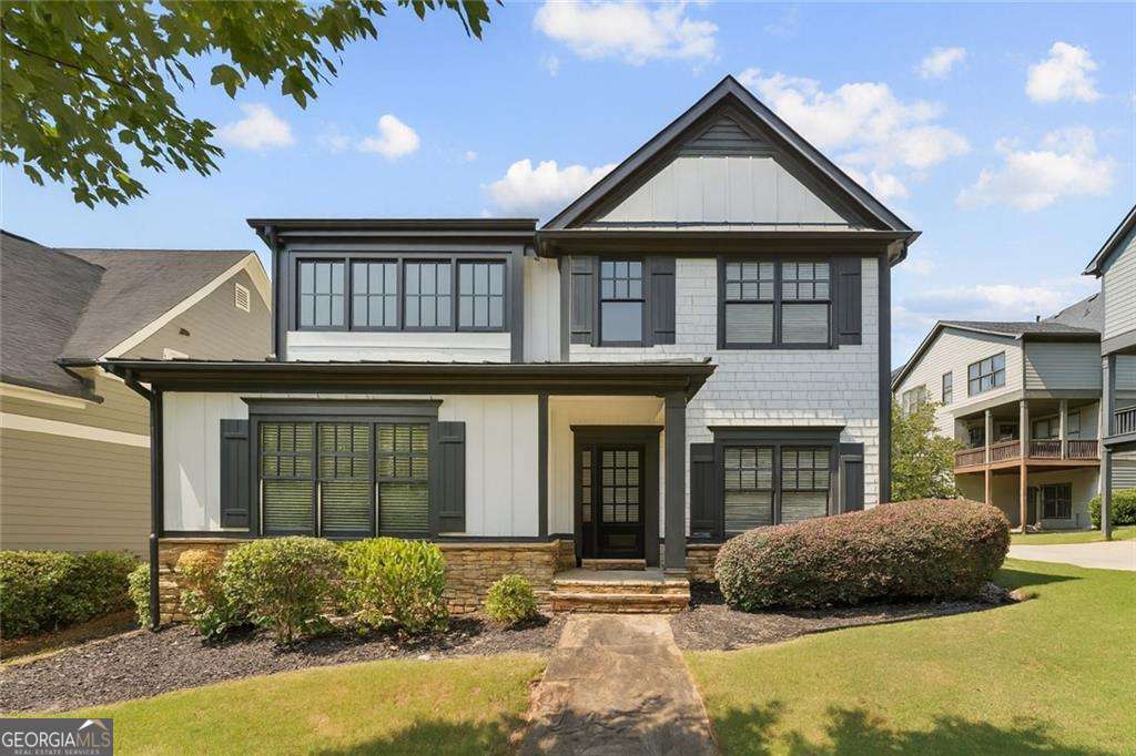 Welcome to West Highlands living at its finest, a corner-lot Craftsman charmer that blends timeless curb appeal with modern upgrades, all tucked away on one of the neighborhood's premium lots. From the moment you arrive, the stone accents, fresh exterior, and inviting two-story foyer set the tone for a home that feels equal parts stylish and comfortable. Inside, the open-concept layout delivers exactly what today's lifestyle demands: a vaulted family room drenched in natural sunlight, a spacious dining room for hosting friends, and a sleek, modern kitchen designed for both form and function. The kitchen pops with sage green shaker cabinetry, quartz countertops, stainless appliances, updated lighting, making it the true heart of the home. The primary suite is a retreat in itself, featuring a spa-inspired bathroom with quartz counters, a stunning tiled shower, and designer finishes. Two additional bedrooms and an updated guest bath with double vanities offer flexible living space for guests, roommates, or a home office. Throughout the home, you'll find newer carpet, updated LVP flooring, stylish lighting, and two-inch wood blinds, all the thoughtful details that make it move-in ready. Add in the rear-entry two-car garage, ample driveway parking, and corner-lot privacy, and this home checks all the boxes. Perfect for the buyer who wants style, location, and low-maintenance living with a little bit of swagger. Step outside and enjoy the perks of West Highlands: a swimming pool, playground, dog park, and community green spaces. On weekends, you're minutes from breweries, Topgolf, Atlanta Pickleball, The Works, and the buzz of West Midtown and the Upper Westside. With easy access to the airport and major highways, convenience is built right in. 1784 Hollingsworth Blvd isn't just a home, it's a lock and leave, low maintenance lifestyle for the busy professional!