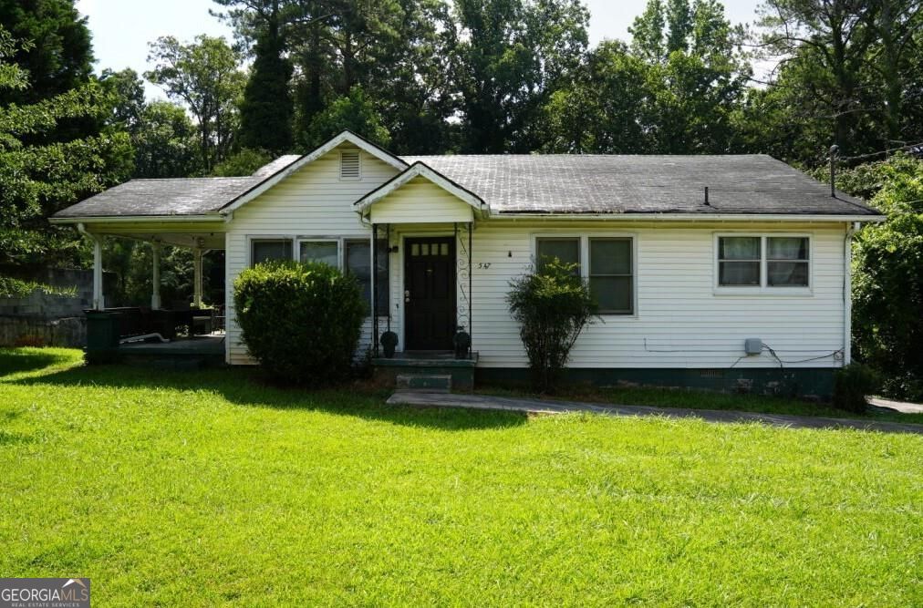 Investor-friendly opportunity in a prime Stone Mountain location! This traditional 2-bedroom, 1-bath home features an open floor plan, a spacious front yard, and plenty of parking-including a rear parking pad. Step outside to a cozy patio, perfect for relaxing or entertaining. Located near a bus stop and just minutes from I-285. No HOA means more flexibility for rentals or future improvements. Whether you're looking to expand your investment portfolio or find your next project, this property offers great potential!