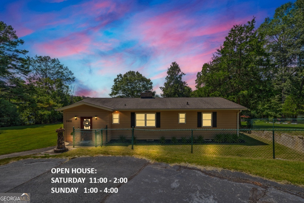 Lake, Lake, Lake! Enjoy lakefront living with 151 feet of shoreline on the stunning 55 +|- acre Rockdale Lake! This lot has one of the largest shorelines on the lake! This one level 2-bedroom, 1.5-bath home also features a versatile bonus room which can also serve as a 3rd bedroom, office, or game room. Inside, you'll appreciate a generous laundry and pantry offering plenty of storage and functionality. The exterior is just as impressive with stunning lake views, a fenced side yard perfect for pets, circular driveway, two-car carport with attached storage, plus a separate storage-workshop. Relax and entertain at the large lakefront fire pit, or enjoy endless water activities-boating, fishing, jet skiing, paddle boarding, kayaking, swimming, and more. This meticulously maintained 0.59-acre lot with lush Zoysia grass awaits your outdoor games and family gatherings. Spend evenings enjoying lake cruises and have the convenience of your own private dock. Water depth at dock is 8' +. Conveniently located close to downtown Conyers, shopping, restaurants, and with easy access to Interstate 20. Don't let this gem pass you by!