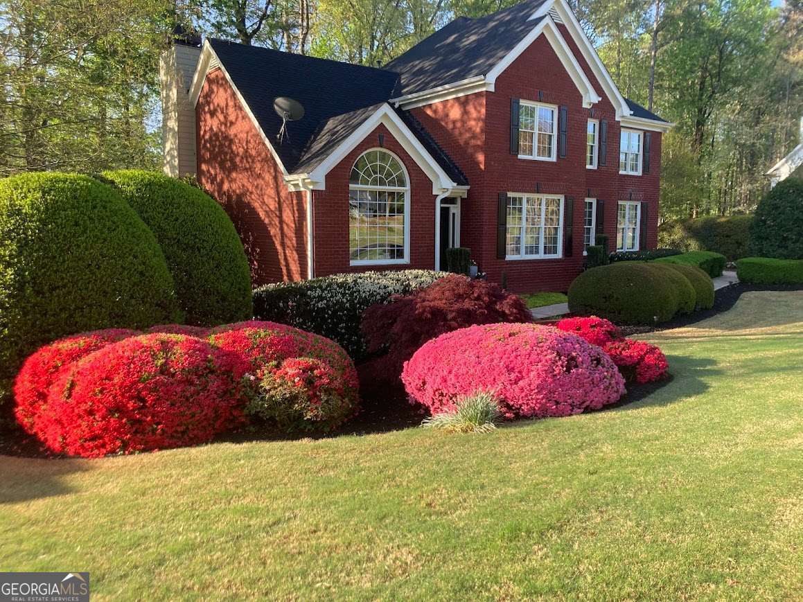 North-facing and beautifully maintained, this 5-bedroom, 3.5-bath home offers luxury and convenience in the highly sought-after Hamptons Grant neighborhood of Alpharetta. Located in Forsyth County with lower taxes, this residence provides the best of both worlds-peaceful privacy and close proximity to all the area's top amenities. Your home features two fully equipped kitchens and two laundry rooms, adding both convenience and versatility to the living space. The fully finished in-law suite with a separate entrance ensures privacy and flexibility, making it ideal for multigenerational living or as a private retreat. Enjoy access to desirable community swim and tennis amenities, perfect for active lifestyles. With seamless access to GA400 and HWY 20, Downtown Milton, Downtown Alpharetta, Cumming, Roswell, top-rated schools, shopping, dining, and entertainment are just moments away. Perfect for families and commuters alike, the location makes navigating Atlanta and surrounding areas effortless. Don't miss out on the opportunity to call this exceptional property home. Schedule your private tour today and experience the charm and luxury of living in this Alpharetta gem while enjoying Forsyth County taxes .