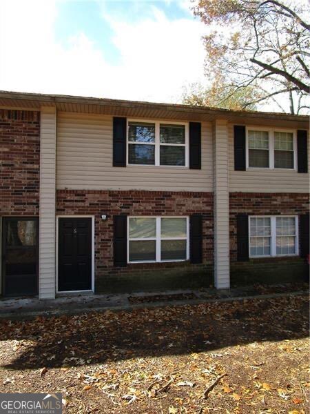 2 bedroom, 1.5 bath 2-story condo located in quiet complex in city limits off Riverside Dr. Newer windows, LPV laminate in downstairs LR & DR, plantation blinds, carpet upstairs. Kitchen has Denmark kitchen cabinets, countertop, travertine tile, marble backsplash, electric stainless steel appliances & side by side refrigerator. Recessed LED lighting throughout. Full size washer & dryer included. Bathroom upstairs remodeled w/ tiled shower & glass doors. Wood deck off of back entry. Community pool. Convenient to Gainesville Elementary School, restaurants & park.