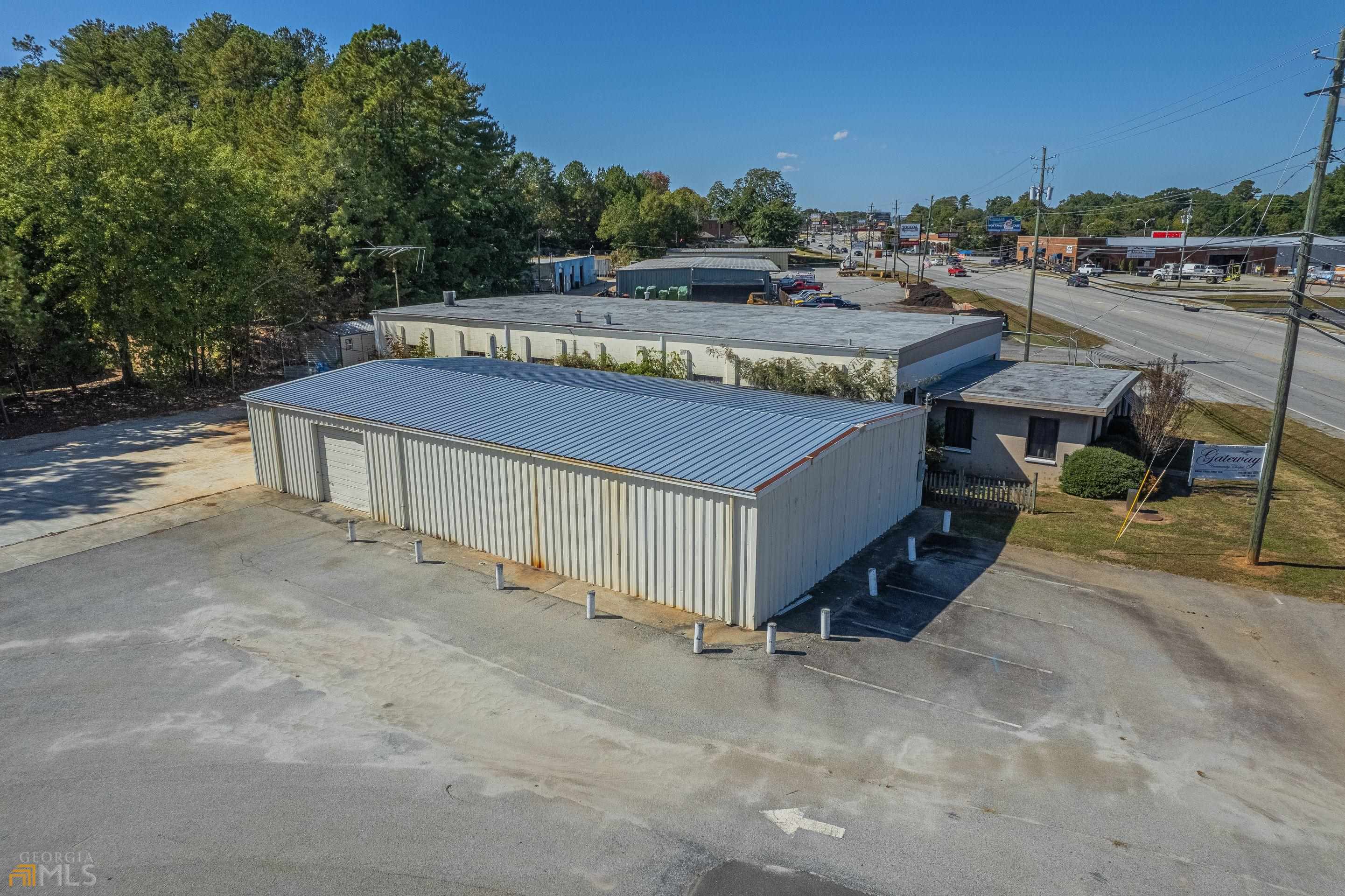 High Traffic Location on Corner Level Lot with plenty of room for parking or future expansion. 2400 sf building, presently used for storage. Updated electrical (2021) and new roof 2022. The original building was torn down and the perfect lot and building site is in place. Nice frontage on Big A Road and side entry from Rothell Road. Paved parking and driveway. Hwy 17/Big A Road in Toccoa. Near dining, shopping, and banking.
