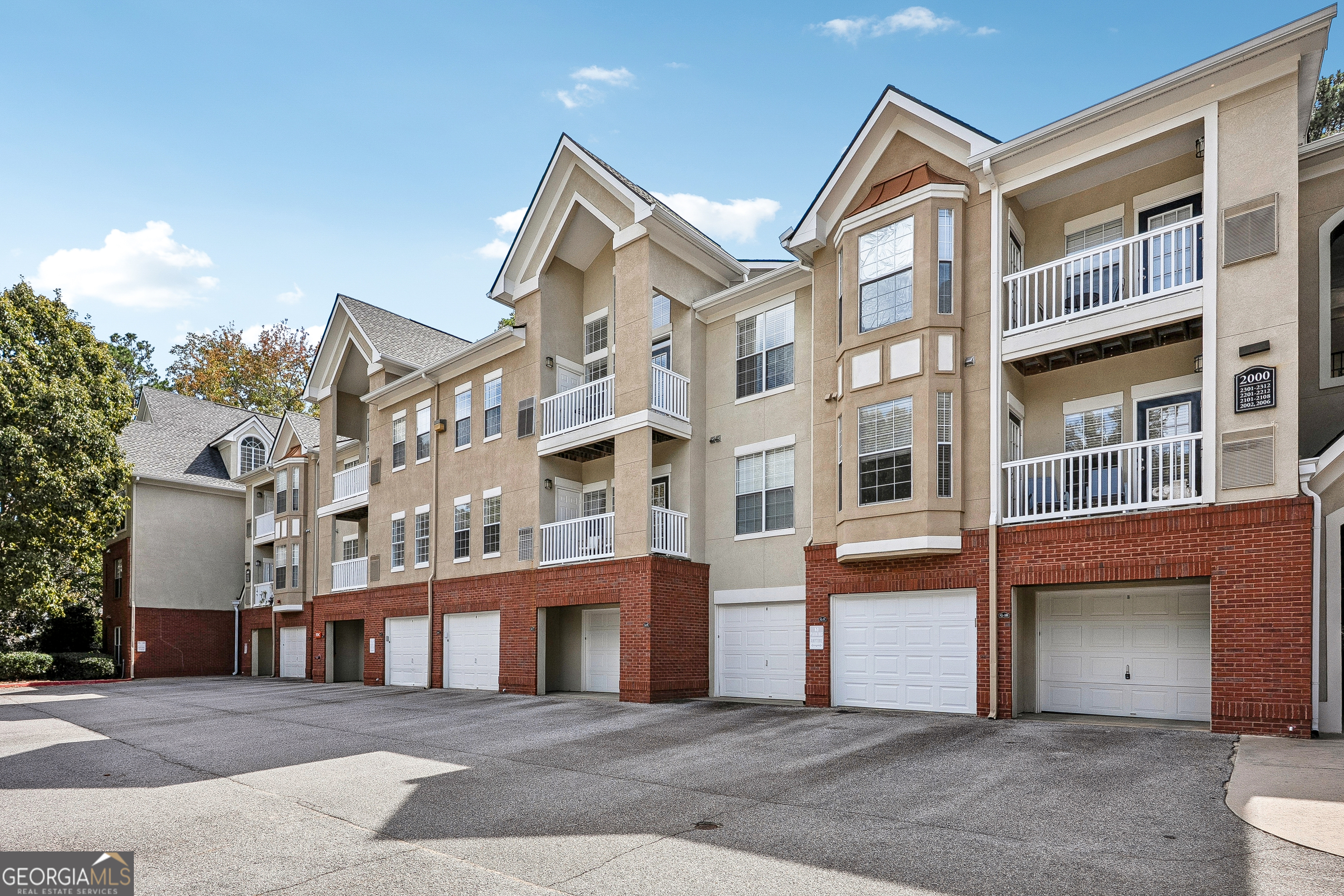 A quiet escape with fast city access - walkable restaurants, quick commutes and thoughtful modern finishes. Work downtown, live peacefully here. Spacious 2BR/2BA condo in a in Gated Community with with fast city access, secure building with ideal split-bedroom layout-perfect for roommates, families, or remote work. Entryway features a true foyer with coat closet leading to an open concept but defined dining and living area with bonus office or reading nook. The kitchen includes ample cabinetry, stone counter-tops, a walk-in pantry, and a pass-through window-great for entertaining. The ensuites are positioned at opposite ends of the condo for maximum privacy. Both bedrooms offer large windows, newer flooring, and walk-in closets. The community offers all include a pool, tennis courts, walking trails, renovated social room, fitness center, dog park, theater, and package room and onsite management. Corner garage + covered parking, just steps from your front door. You're minutes from Emory University, Decatur's vibrant scene, the CDC, Children's Healthcare of Atlanta, and major corridors