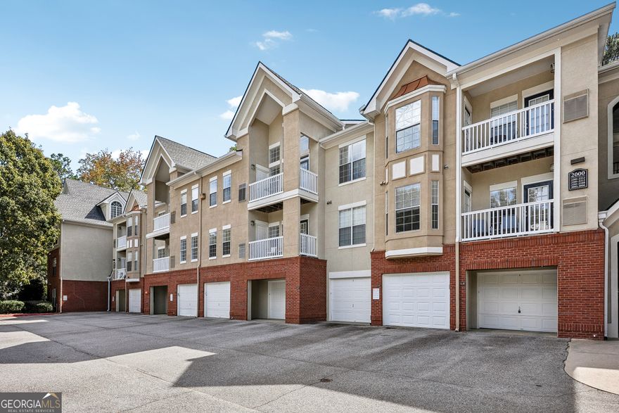 A quiet escape with fast city access - walkable restaurants, quick commutes and thoughtful modern finishes. Work downtown, live peacefully here. Spacious 2BR/2BA condo in a in Gated Community with with fast city access, secure building with ideal split-bedroom layout-perfect for roommates, families, or remote work. Entryway features a true foyer with coat closet leading to an open concept but defined dining and living area with bonus office or reading nook. The kitchen includes ample cabinetry, stone counter-tops, a walk-in pantry, and a pass-through window-great for entertaining. The ensuites are positioned at opposite ends of the condo for maximum privacy. Both bedrooms offer large windows, newer flooring, and walk-in closets. The community offers all include a pool, tennis courts, walking trails, renovated social room, fitness center, dog park, theater, and package room and onsite management. Corner garage + covered parking, just steps from your front door. You're minutes from Emory University, Decatur's vibrant scene, the CDC, Children's Healthcare of Atlanta, and major corridors