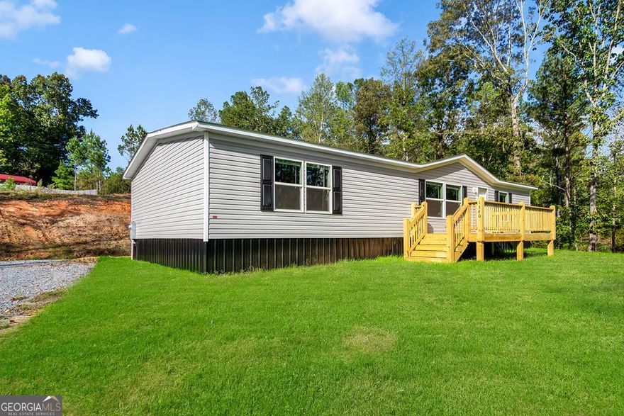 FINISHED NOW- Brand New 2025 Home- Move-In Ready NOW! Home is completely finished! Don't miss your chance to own this stunning 3 bed, 2 bath, 1,568 sq ft home on 1.7 acres of land, with no HOA perfectly nestled just 9 minutes from charming Downtown Ellijay! Set on a permanent metal foundation with retired title, this home combines modern design with peaceful mountain living - all on paved roads and a gravel driveway with high- speed internet, great cell service and your own private well and septic! Inside, enjoy tall ceilings, an open concept living space with a stylish accent wall, a beautiful kitchen with stainless steel appliances, custom cabinets, a large island, and a cozy dining area. The spacious master suite features a large walk-in closet, and luxurious bath with a soaking tub/shower combo, and a nice sink. Two additional bedrooms and a full bath complete the layout. The flat yard perfect for pets to roam, peaceful surroundings, and no HOA (just minimal covenants to preserve the area's charm) make this home ideal for full-time living or a weekend escape. Shared driveway agreement in place; new survey, well, septic, power, and internet are already done. Few deed restrictions to keep the area ncie. Everything is brand new and move-in ready - schedule your showing today before it's gone!