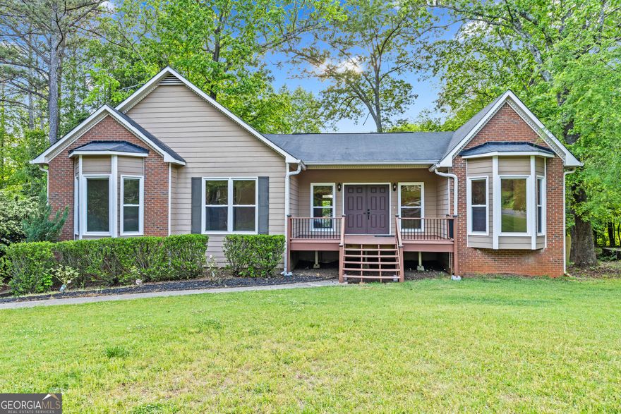 Spacious 4BD/3BA Gem in Top-Rated Lassiter School District - With Finished Basement & Dreamy Outdoor Living!    This is a must-see! Located in the highly sought-after Lassiter school district, this beautifully maintained East Cobb home offers 4 bedrooms, 3 baths, and a full finished basement-perfect for entertaining, relaxing, or extra living space.    Inside, you'll find a beautifully maintained home featuring a separate dining area, a chef-inspired kitchen with solid wood cabinets, granite countertops, space for dining and all appliances included!    The inviting family room features vaulted ceilings and a brick fireplace, with direct access to a newly built porch off  the living room    Though this home has two levels, three of the 4 bedrooms in the home are on the main level, giving the home a ranch-style feel. In addition to two bedrooms and full bathroom on the main level, there is also a large Primary suite, equipped with a spa-like bath with a custom tiled shower and soaking tub    Need storage? You've got it!-tons of space in the 2-car garage plus a huge basement that includes a storage room and an additional bedroom and bathroom, ideal as an in-law suite, gym area or an office.    Outside, the large backyard offers garden beds, a shed, fire pit and plenty of space to play or unwind.     Located just minutes from I-75, I-575, KSU, Kennestone Hospital, shopping & dining, with an optional pool membership in a voluntary HOA community.     Homes in this location don't last-schedule your private tour today!