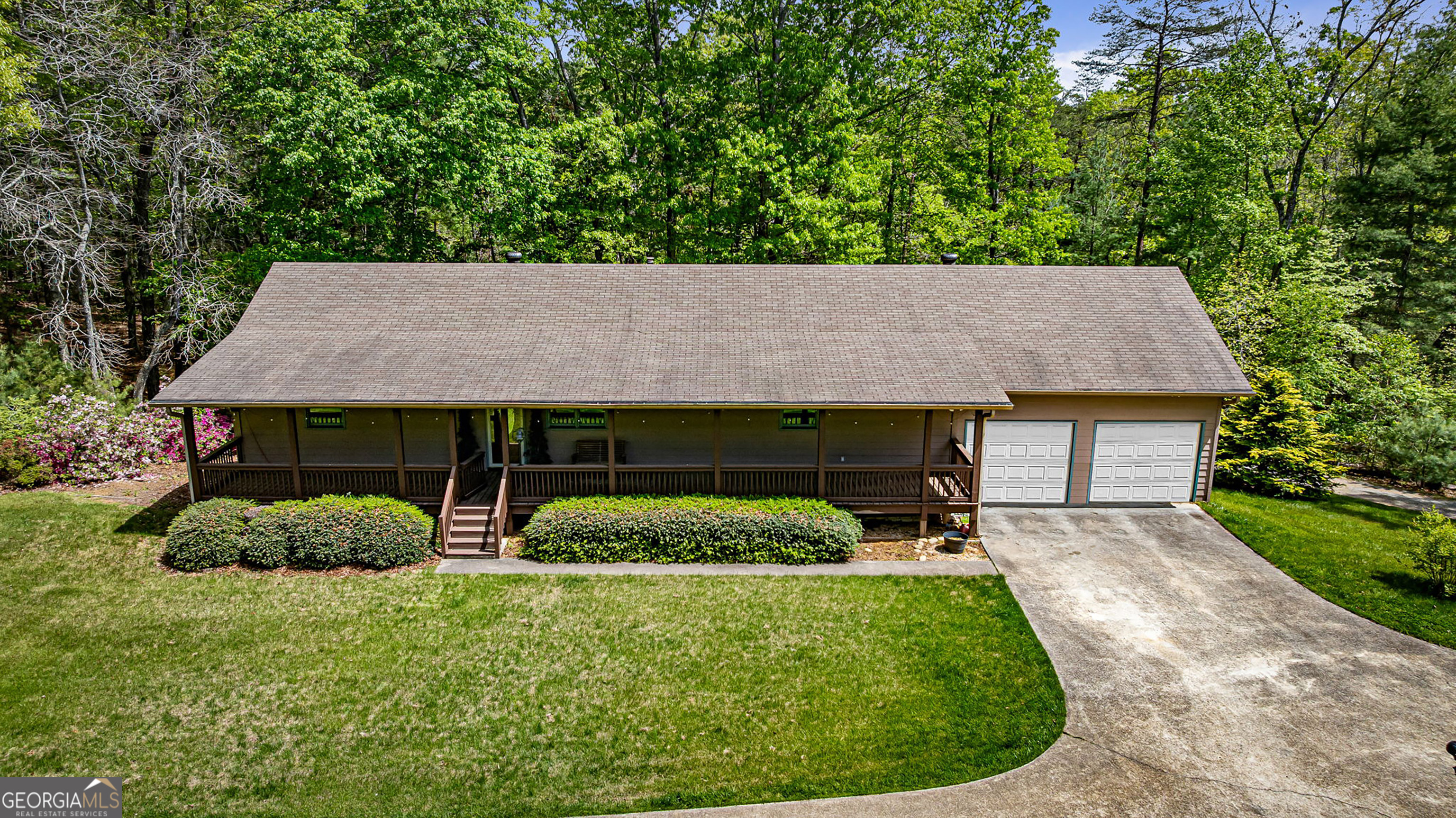 Private Rustic Retreat on 10 Acres in the North Georgia Mountains Welcome to your mountain getaway! Nestled on 10 serene and private acres, this beautifully maintained rustic home offers the perfect blend of comfort, functionality, and outdoor living. The spacious main level features a large master suite, two guest bedrooms, and an oversized laundry/mudroom for added convenience. The open-concept kitchen flows seamlessly into the living area, creating a warm and inviting space ideal for entertaining or just relaxing. The full-size basement is a true bonus, boasting a finished man cave, workshop area/additional garage space-perfect for hobbies, storage, or extra vehicles. Enjoy the peaceful surroundings from the expansive front porch or the private back deck. Fenced areas provide a safe space for pets, and the generous acreage offers endless possibilities for gardening, recreation, or establishing your own mini-farm. Have outdoor toys? Don't miss the 35 x 40 Three Bay metal building!!! This property is the ideal blend of rustic charm and modern comfort-don't miss the opportunity to make it your own!