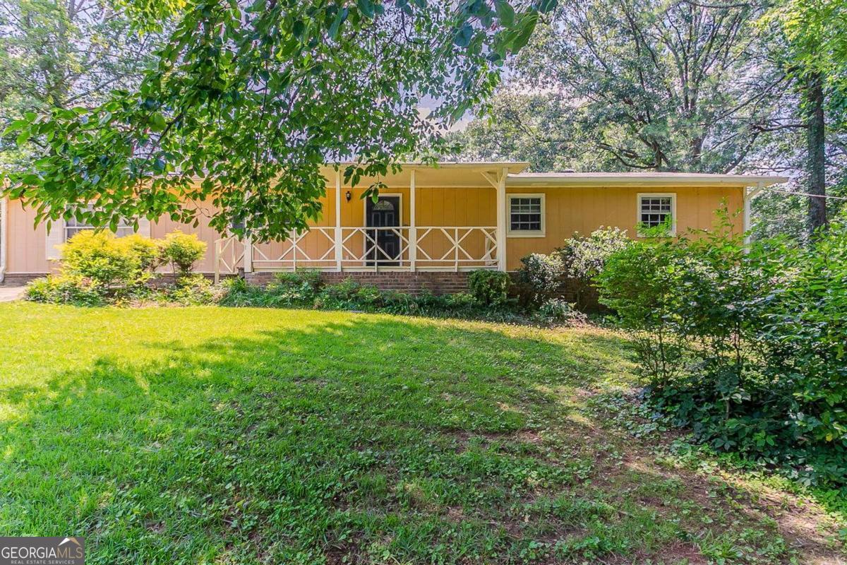 Charming one-level home nestled on a corner lot in Annistown Ridge. This ranch layout offers three bedrooms, a large family room with a fireplace, and a kitchen with a breakfast bar and walk-in pantry. Enjoy a spacious laundry area, updated flooring, and a generous rear deck overlooking the fenced yard. Additional perks include a side entry parking pad and covered front porch. Located in a quiet neighborhood with no HOA, close to parks, shopping, and major roads.