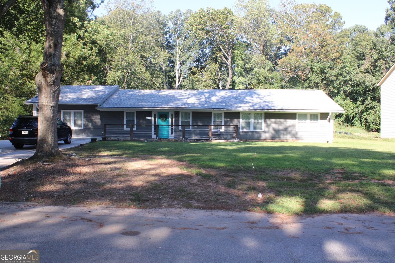 Now available for rent, this beautifully renovated 4-bedroom, 3-bathroom ranch offers the perfect blend of modern updates and prime location-just minutes from Hartsfield-Jackson Airport, downtown Atlanta, Camp Creek Parkway, and the prestigious Woodward Academy. Inside, you'll find an open-concept layout designed for both comfort and functionality. The fully updated kitchen features stainless steel appliances and an oversized island that provides ample space for meal preparation, casual dining, or entertaining. The living and dining areas flow seamlessly beneath vaulted ceilings, with natural light pouring in through large windows. The renovated primary suite is a true retreat, complete with new flooring, a luxurious standalone soaking tub, and its own private entrance. A second primary suite has also been updated with new flooring for added comfort. Situated on nearly an acre of land, this home features a spacious, level front and backyard, along with a large deck-perfect for outdoor living. With no HOA, you'll enjoy the freedom and flexibility that rental homes rarely offer. Don't miss this rare opportunity to lease a fully renovated home in an unbeatable location.