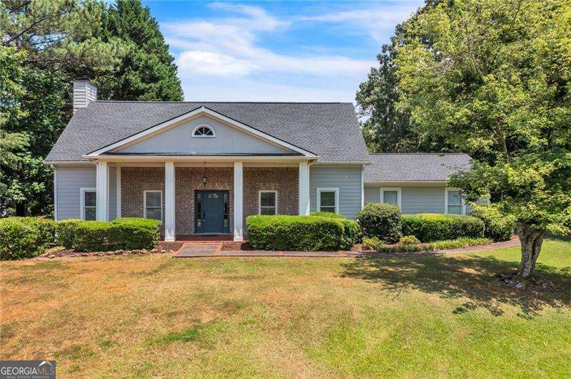 Welcome HOME to your own little slice of country living! 3BD/2.5BA traditional home on 1.34 acres backing up to Lake Vaugh. 2-story foyer, huge kitchen w/ granite tops, newer appliances, double ovens, island with smooth cooktop and pot filler. Large family room w/ brick fireplace and additional office area plus Formal dining room. All bedrooms are upstairs. Master Suite with updated bathroom, dual vanities and glass shower. Hardwood floors in bedrooms. Loads of closet space. Covered back patio overlooks fenced in yard with oversized deck for entertaining. Shed and covered area for storage off shed. Lake Vaugh allows non-motorized boats. 3.5-year old roof! Convenient location just 15 minutes from allll the shopping and dining that Cartersville has to offer.