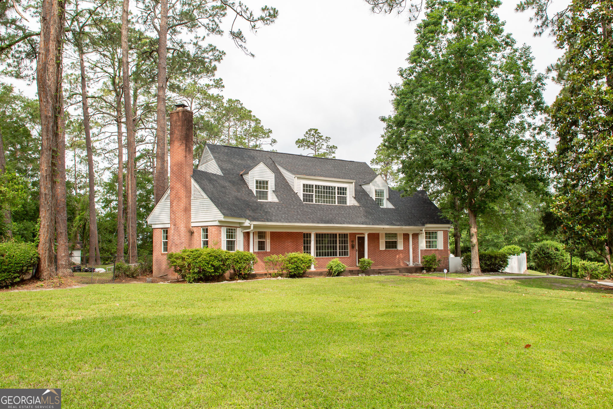 Located in the coveted neighborhood of Cherokee Heights, this charming brick home offers a blend of character, space, and potential. Featuring four bedrooms and three full bathrooms, the home sits on a generous 1.09-acre corner lot. Natural light pours into the living areas, highlighting the beautiful hardwood flooring throughout. A recently installed roof is a plus, while the expansive yard provides plenty of room for outdoor enjoyment. The in-ground pool is in need of repair but presents an exciting opportunity to create your own backyard retreat. A rare find in a sought-after location!
