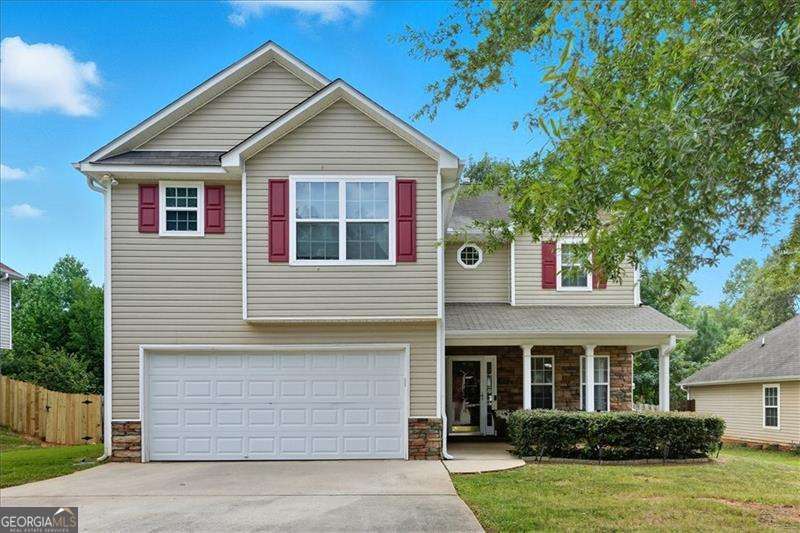 This beautifully maintained 3 bedroom, 2.5 bathroom home offers over 2,100 sq ft of living space and is ready for its next owner. Step inside and be greeted by soaring 18 ft ceilings in the living room, a cozy fireplace, and a layout designed for both comfort and function. The spacious kitchen features an island, ample storage, and plenty of room to gather - perfect for family meals or entertaining guests. Upstairs, you'll find two secondary bedrooms connected by a convenient Jack & Jill bathroom, while the primary suite provides its own retreat.Recent updates include a brand-new HVAC system (2024), giving peace of mind for years to come. Outside, enjoy the fenced backyard, ideal for kids, pets, or weekend barbecues.Whether you're a family searching for more space or an investor looking to add to your rental portfolio, this home checks all the boxes.