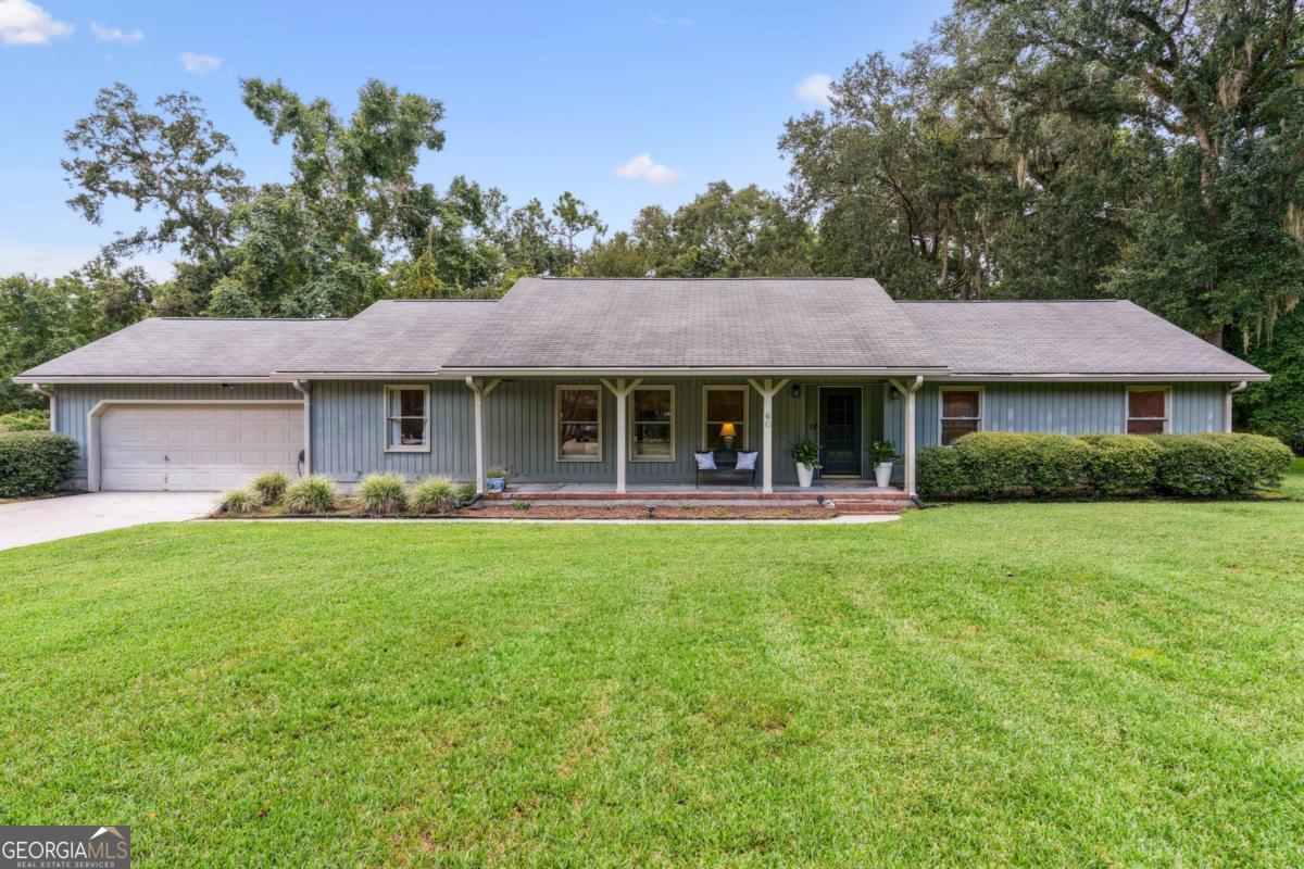 Welcome to this desirable Sadler Cove community with NO city taxes and NO HOA! Set on nearly an acre, this 3-bedroom, 2-bath home offers a thoughtfully designed layout with multiple living spaces and recent updates throughout. As you enter the foyer, you are greeted by a generous family room with ample space. Adjacent to the family room is the formal dining room, which flows seamlessly into the dinette and kitchen with new quartz countertops. Just beyond, a cozy den with a wood burning fireplace provides the perfect spot to relax and offers direct access to the backyard and new poured-concrete patio. The primary suite and two additional bedrooms provide comfortable accommodations, while the freshly painted full interior adds a bright, move-in-ready feel. Sadler Cove is ideally located only 3.5 miles from I-95 at Exit 7, offering quick commutes to the Golden Isles, Kings Bay Naval Base, and Jacksonville, FL.