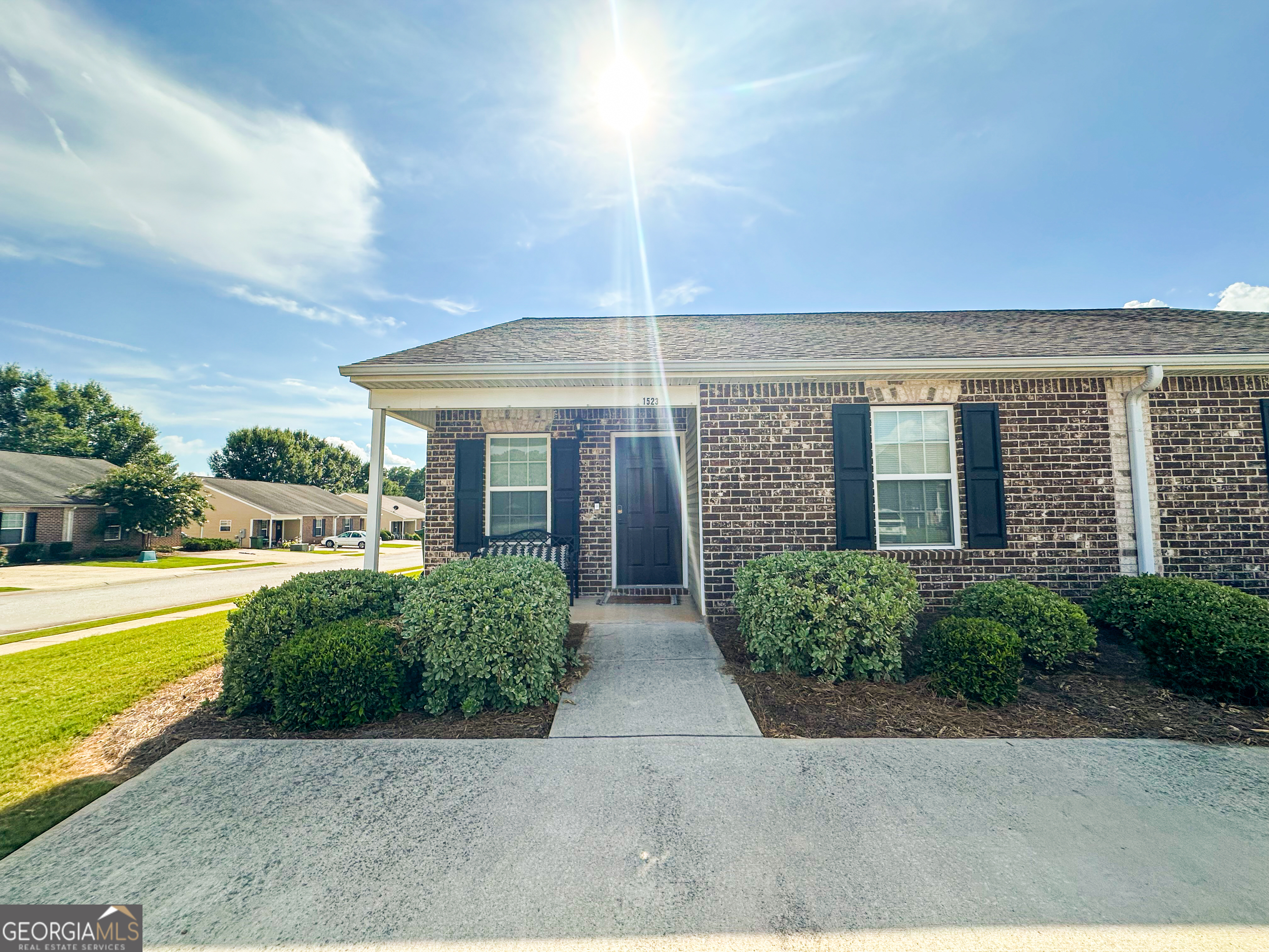 DON'T MISS OUT!! Come see this immaculate town home before it's too late. Built in 2018 and still essentially in brand new condition, this 2/2 is sure to impress. A corner lot for extra yard space and privacy is a huge bonus for the community. As you arrive, you'll notice the wide parking bad and covered front porch for relaxing in the morning and/or evening. As you enter, the light and airy open floor plan will greet you. To your left, the perfectly sized kitchen that is easy to keep clean with bar seating as well overlooks the dining area and living room. To the right is the secondary bedroom or flex room ready to be whatever you need it to be. The secondary bedroom has access to the guest bath setting up a great roommate situation if needed. To the rear of the home you'll find the primary bedroom along with a large primary bedroom closet as well as the bathroom with plenty of room for a dual vanity if desired. Out back, a large patio ready for entertaining, a storage area for holiday decor/extra storage, and the yard that's ready for pets or some gardening. Front and side yard maintenance are handled by the HOA, so all you're responsible for is the backyard. So your neighborhood will be nice and neat as all of the yards will be well maintained at the same time. All of this in this highly desired neighborhood at this price,... Call today to schedule your own private showing!