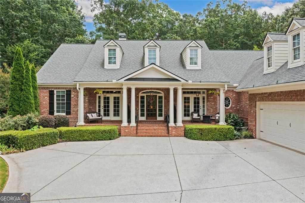 Set at the end of a peaceful cul-de-sac, this custom-built brick ranch on a full basement offers rare privacy, quality craftsmanship, and room to live and grow, all on over an acre of beautifully designed outdoor space. Located into a sought-after community with swim, tennis, and walking trails. Inside, vaulted and tray ceilings draw your eye to the picturesque windows across both the front and back of the home, flooding the main level with natural light. Hardwood floors run throughout, leading you into a spacious open kitchen featuring granite countertops, stainless steel appliances, walk-in pantry, and a cozy vaulted keeping room with a gas fireplace. The primary suite offers a peaceful retreat with mountain views, a large soaking tub with jacuzzi jets, a walk-in shower, upgraded lighting, and a designer-built closet. From the screened-in porch and upper deck to the terrace level walkout, every level of this home connects effortlessly to the outdoors. The backyard is a showstopper with an arbor-covered nature trail, fire pit with Adirondack chairs, hot tub, overlook with long-range mountain views, built-in horseshoe pit, and fully fenced yard. An automatic irrigation system with rain sensor keeps the abundant landscaping thriving, and landscape lighting sets the scene for evenings outside. The fully finished terrace level includes an in-law suite with extra kitchen, fitness room with mirrors, media room, workshop, a bolted-down safe, a safe room, and plenty of storage. This home is equipped with a whole-house natural gas generator, four RING cameras, a central vacuum system, surge protector, radon removal system, and protective garage floor coating. It's all here, peace, privacy, and thoughtful upgrades inside and out.
