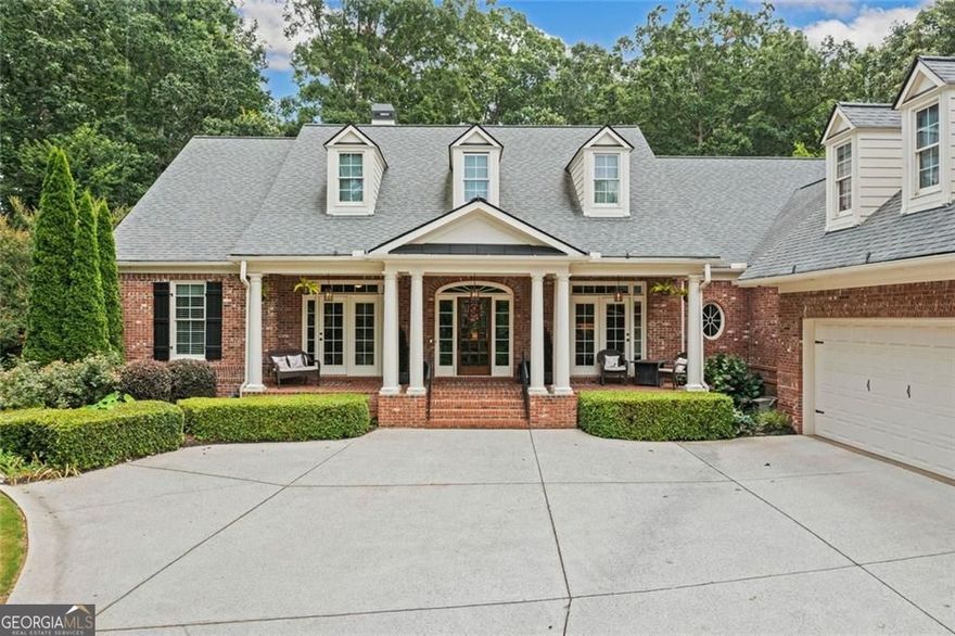 Set at the end of a peaceful cul-de-sac, this custom-built brick ranch on a full basement offers rare privacy, quality craftsmanship, and room to live and grow, all on over an acre of beautifully designed outdoor space. Located into a sought-after community with swim, tennis, and walking trails.  Inside, vaulted and tray ceilings draw your eye to the picturesque windows across both the front and back of the home, flooding the main level with natural light. Hardwood floors run throughout, leading you into a spacious open kitchen featuring granite countertops, stainless steel appliances, walk-in pantry, and a cozy vaulted keeping room with a gas fireplace.  The primary suite offers a peaceful retreat with mountain views, a large soaking tub with jacuzzi jets, a walk-in shower, upgraded lighting, and a designer-built closet. From the screened-in porch and upper deck to the terrace level walkout, every level of this home connects effortlessly to the outdoors.  The backyard is a showstopper with an arbor-covered nature trail, fire pit with Adirondack chairs, hot tub, overlook with long-range mountain views, built-in horseshoe pit, and fully fenced yard. An automatic irrigation system with rain sensor keeps the abundant landscaping thriving, and landscape lighting sets the scene for evenings outside.  The fully finished terrace level includes an in-law suite with extra kitchen, fitness room with mirrors, media room, workshop, a bolted-down safe, a safe room, and plenty of storage. This home is equipped with a whole-house natural gas generator, four RING cameras, a central vacuum system, surge protector, radon removal system, and protective garage floor coating.  It's all here, peace, privacy, and thoughtful upgrades inside and out.