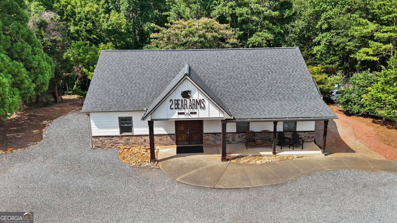 Rare Commercial Opportunity on Prime Corner Lot in Cherokee County, one of North Metro Atlanta's fastest growing communities! Versatile commercial property strategically positioned on Hwy 140, a high-traffic area passing through the heart of Canton with ~20k+ VPD. This property offers unmatched visibility and accessibility, ideal for a variety of business uses or potential commercial development. The building features a spacious open floor plan, a dedicated office area, storage space, and a private restroom. Perfectly suited for a functional and adaptable space. Recent updates include a brand-new roof and the addition of 600 sq ft of finished space, enhancing both utility and value. Adjoined by an additional 0.94 acres zoned general commercial (GC), offering 1.96 commercial acres and boasting approximately 388 ft of road frontage. Easily accessible, ample on-site parking, and is surrounded by established and emerging residential neighborhoods and thriving commercial development. Conveniently located just minutes from I-575, Riverstone Pkwy, Hwy 140, Downtown Canton, The Mill, Etowah River, outdoor parks and so much more. Hwy 140 & Pearidge offer direct access to major corridors and the rapidly expanding market, only minutes from Teasley Middle School PLUS the highly anticipated, upcoming New Cherokee High School expected to open August 2026.