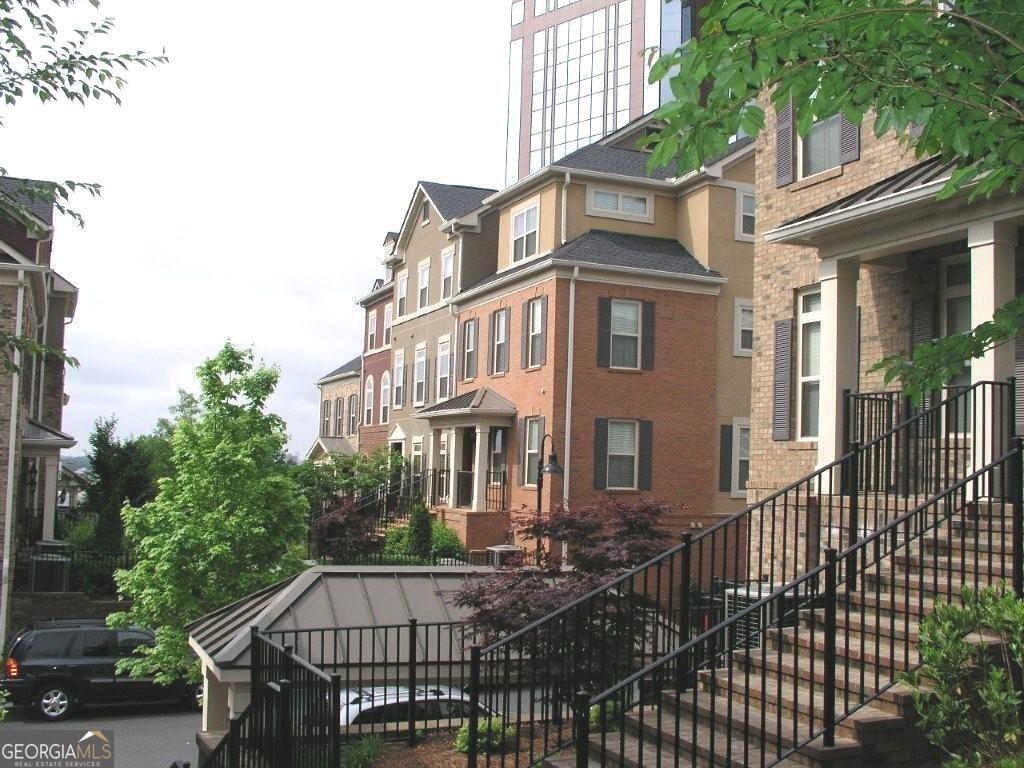 PREMIUM LOCATION IN A GATED TOWNHOME COMMUNITY - ENJOY THE BEST OF ATLANTA LIVING! JUST STEPS AWAY FROM TOP-RATED RESTAURANTS, PERIMETER'S VIBRANT SHOPPING DISTRICT, PARKS, AND ENTERTAINMENT. LOCATED IN A HIGHLY SOUGHT-AFTER SCHOOL DISTRICT. THIS BEAUTIFULLY DESIGNED 3 BEDROOM, 2.5 BATH TOWNHOME FEATURES A 2-CAR GARAGE AND THOUGHTFULLY CRAFTED LIVING SPACES. THE GOURMET KITCHEN BOASTS CUSTOM CABINETRY, GRANITE COUNTERTOPS THROUGHOUT, STAINLESS STEEL APPLIANCES, AND A BAR-IDEAL FOR HOSTING. ENJOY RICH HARDWOOD FLOORS, A COZY OFFICE/LIBRARY WITH FIREPLACE, AND VAULTED CEILINGS THAT CREATE AN OPEN, AIRY FEEL. RELAX ON YOUR PRIVATE BALCONY OR UNWIND IN THE SPA-LIKE JETTED TUB. EXCLUSIVE GATED COMMUNITY AMENITIES INCLUDE A SPARKLING SWIMMING POOL, OUTDOOR GRILLS, AND BEAUTIFULLY LANDSCAPED GROUNDS.