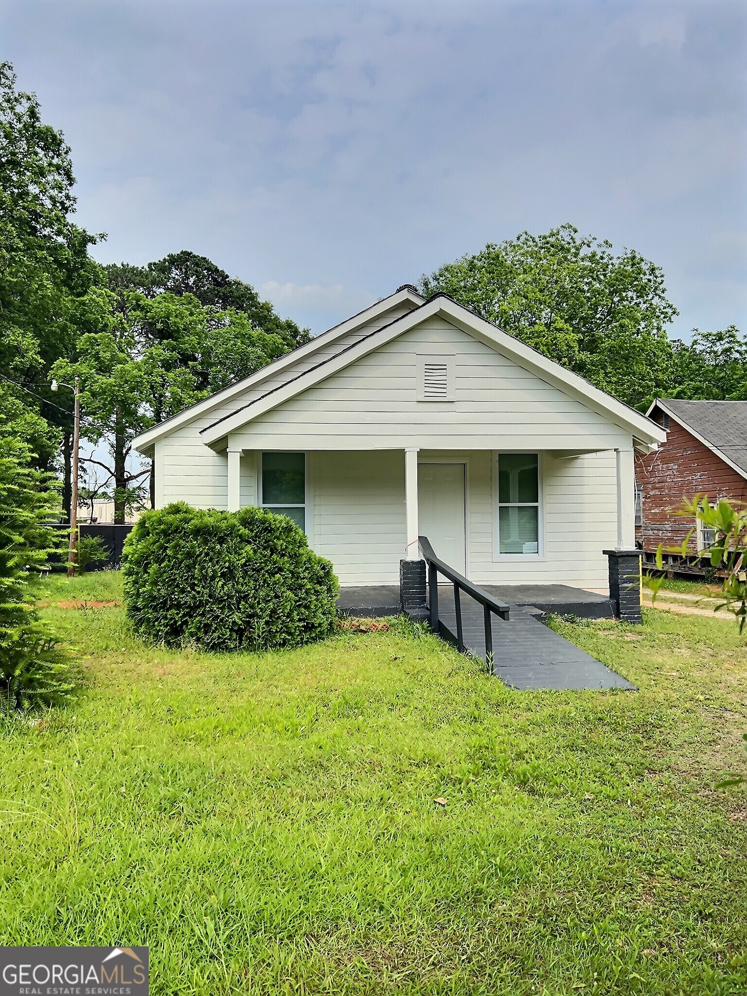 Nicely updated 2 BR 1 BA with a separate dining room and and family room. Front and back porches with spacious yard. Close to downtown Newnan and convenient to I85.