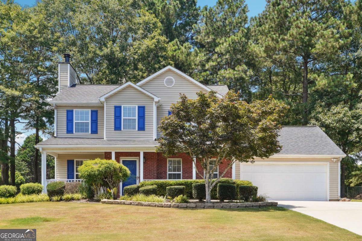 Nestled within the charming and well-established Willow Springs subdivision in Loganville, Georgia, this exquisitely upgraded 3-bedroom, 2.5-bathroom home is a true gem that seamlessly combines modern elegance with everyday functionality. Beautiful curb appeal and a lush manicured lawn is just the beginning. From the moment you step inside, you're greeted by rich, beautiful flooring that extends across the entire main level, offering a cohesive and luxurious foundation to the spacious floor plan. The expansive family room, adorned with a cozy fireplace and the huge eat-in kitchen which provides additional seating and prep space for modern living is truly the heart of the home boasting gorgeous granite countertops, beautiful hardware, an eye-catching subway tile backsplash, updated stainless steel appliances, and custom LED light fixtures that elevate both style and efficiency. The kitchen flows effortlessly into a formal dining area-perfect for hosting gatherings or enjoying quiet family meals. Upstairs, the owner's suite is a private retreat featuring a soaring tray ceiling, upgraded LED ceiling fan, large walk-in closet, and a spa-like en-suite bath complete with double granite vanities, sleek hardware, a separate shower and soaking tub designed for relaxation. Two generously sized secondary bedrooms share a well-appointed full bathroom, also outfitted with granite counters and modern finishes. Throughout the home, energy-efficient LED ceiling fans and lighting enhance comfort and utility, reflecting thoughtful upgrades at every turn. The half bath on the main level offers convenience for guests and is equally refined in its finishes. The home's exterior is just as inviting, with a large, level backyard that's ideal for entertaining, gardening, or simply unwinding. A back patio offers the perfect space for outdoor dining or relaxing, and the two-car garage provides ample storage. Situated on a spacious lot with mature landscaping, this home enjoys a peaceful, neighborhood setting with no HOA restrictions, allowing homeowners more freedom and flexibility. Willow Springs is conveniently located near top-rated schools, shopping centers, dining, and major highways making commutes to nearby cities like Snellville, Conyers, or even Atlanta a breeze. This home provides easy access to everything Loganville has to offer while maintaining the charm of a peaceful, well-maintained neighborhood in a sought-after community. Whether you're looking for a stylish, move-in-ready home or a comfortable space with all the upgrades already in place, this stunning residence in Willow Springs offers the perfect combination of location, luxury, and livability-making it a true gem!